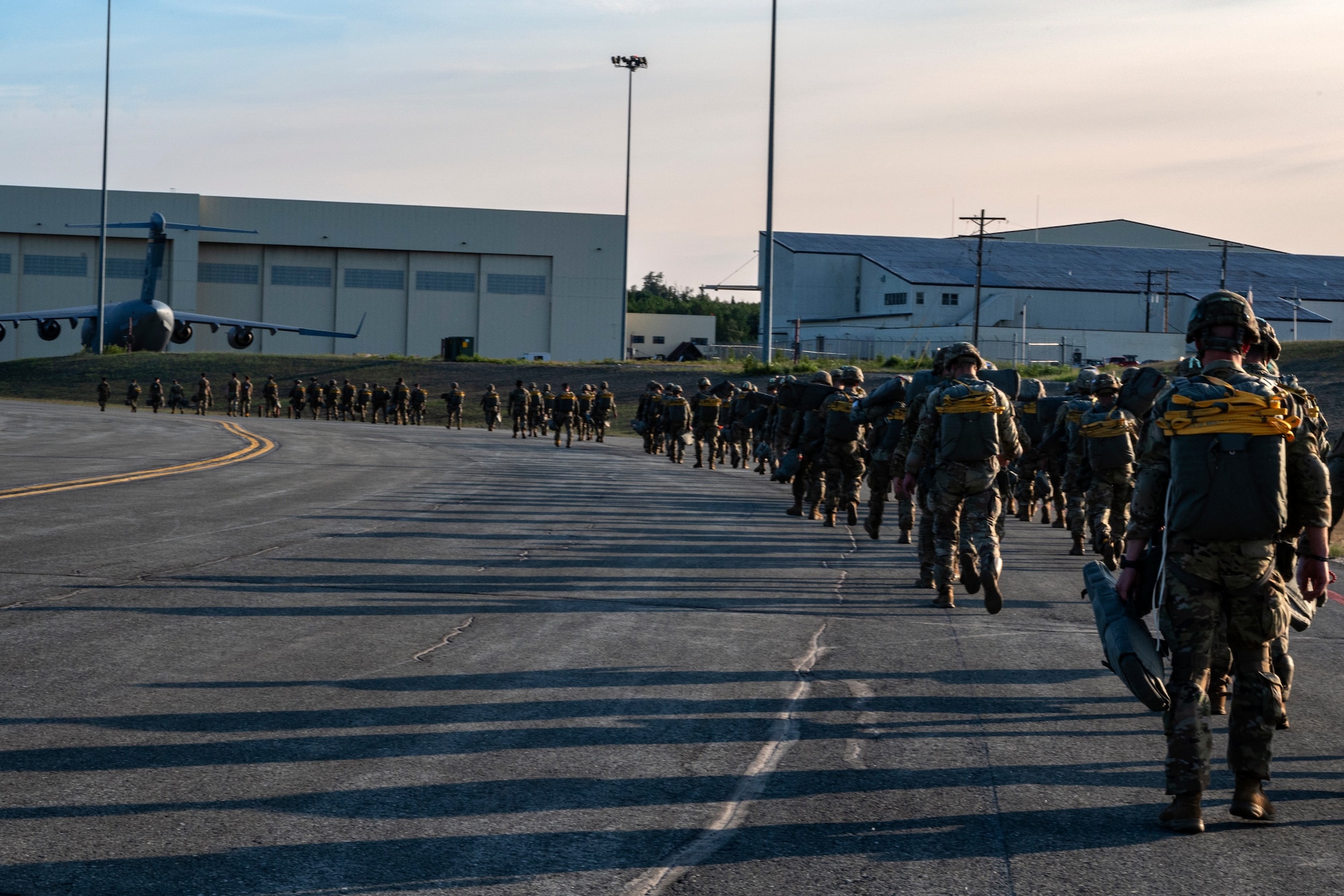 U.S. Army Paratroopers from the 2nd Infantry Brigade Combat Team (Airborne), 11th Airborne Division prepare to jump at Allen Army Airfield, Fort Greely, Alaska, June 15, 2022 during RED FLAG-Alaska 22-2. Approximately 1,600 service members from three nations participate in flying, maintaining and supporting more than 70 aircraft from over 22 units during this iteration of exercise. (U.S. Air Force photo by Sheila deVera)