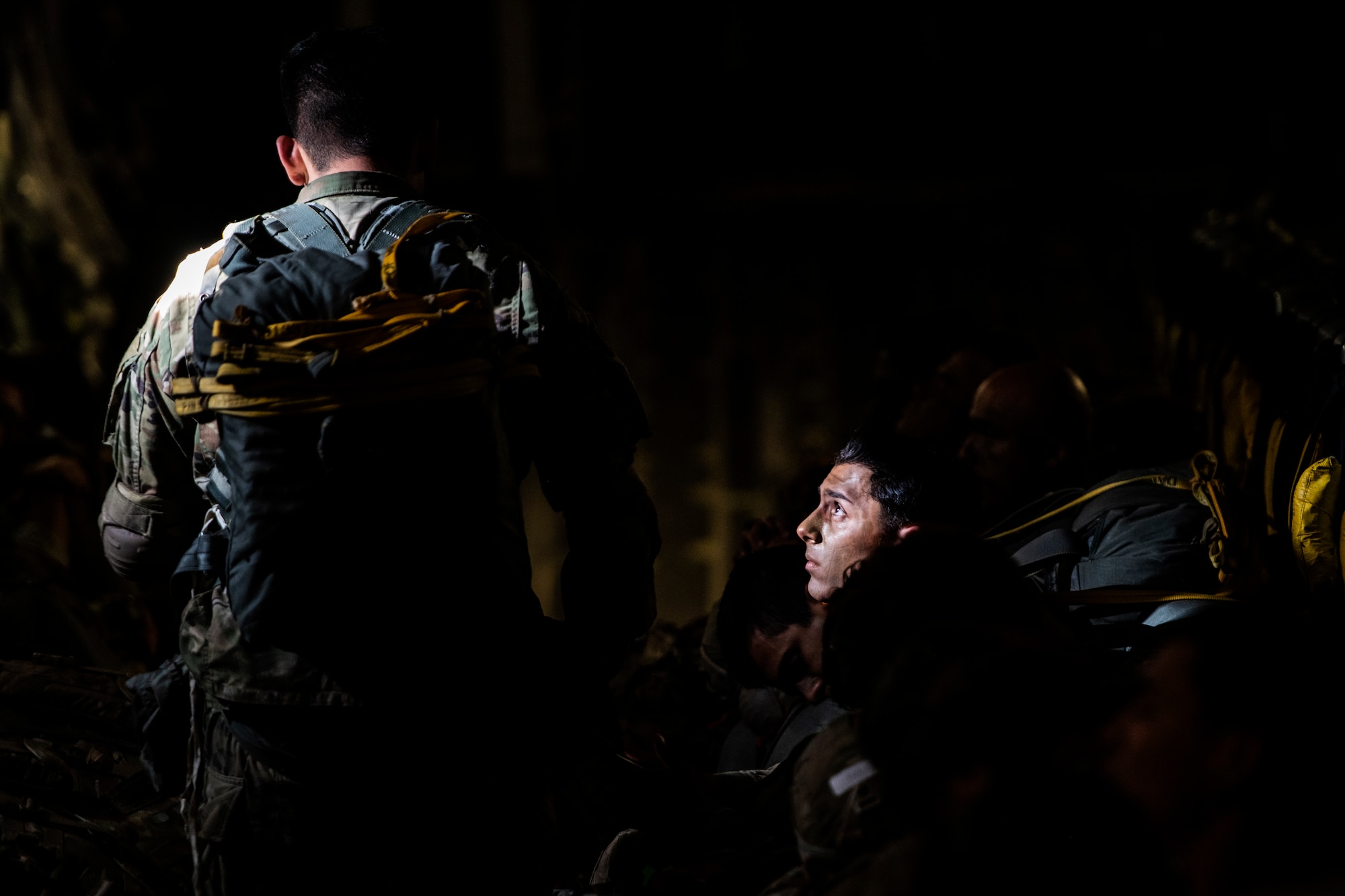 U.S. Army paratroopers wait inside a C-17 Globemaster III assigned to the 517th Airlift Squadron, Joint Base Elmendorf-Richardson, Alaska prior to jumping at Allen Army Airfield, Fort Greely, June 15, 2022 during RED FLAG-Alaska 22-2. RF-A provides realistic combat training by integrating joint, coalition and multilateral forces into simulated forward operating bases. (U.S. Air Force photo by Sheila deVera)