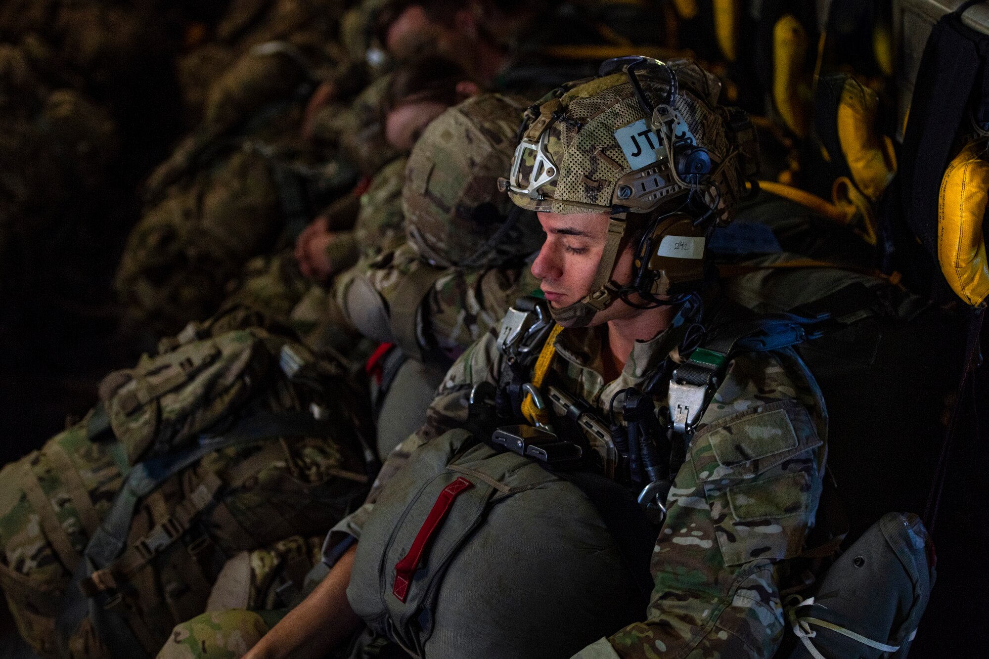 U.S. Air Force Staff Sgt. Alexander Caterinicchio, 3rd Air Support Operations Squadron precision strike operator, waits inside a C-17 Globemaster III assigned to the 517th Airlift Squadron, Joint Base Elmendorf-Richardson, Alaska prior to jumping at Allen Army Airfield, Fort Greely, June 15, 2022 during RED FLAG-Alaska 22-2. RF-A provides realistic combat training by integrating joint, coalition and multilateral forces into simulated forward operating bases. (U.S. Air Force photo by Sheila deVera)