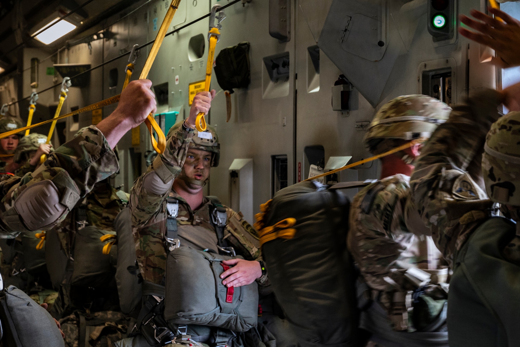 U.S. Army Paratroopers jump out of a C-17 Globemaster III from the 176th Airlift Squadron, Joint Base Elmendorf-Richardson, Alaska over Allen Army Airfield, Fort Greely, June 15, 2022. RF-A provides realistic combat training by integrating joint, coalition and multilateral forces into simulated forward operating bases. (U.S. Air Force photo by Sheila deVera)