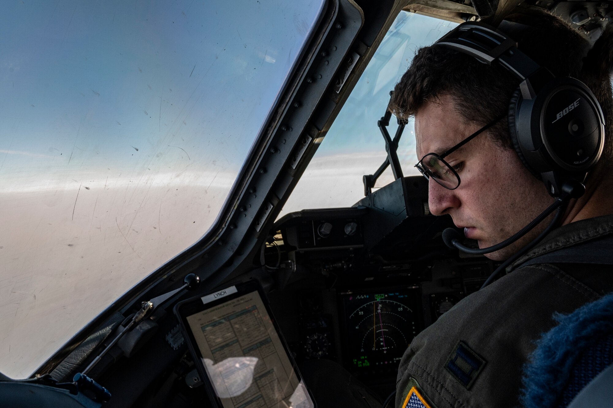 U.S. Air Force Capt. Benjamin Lynch, 517 Airlift Squadron pilot from Joint Base Elmendorf-Richardson, Alaska, flies a C-17 Globemaster III with U.S. Army Paratrooper on June 15, 2022 during RED FLAG-Alaska 22-2. Approximately 1,600 service members from three nations participate in flying, maintaining and supporting more than 70 aircraft from over 22 units during this iteration of exercise. (U.S. Air Force photo by Sheila deVera)