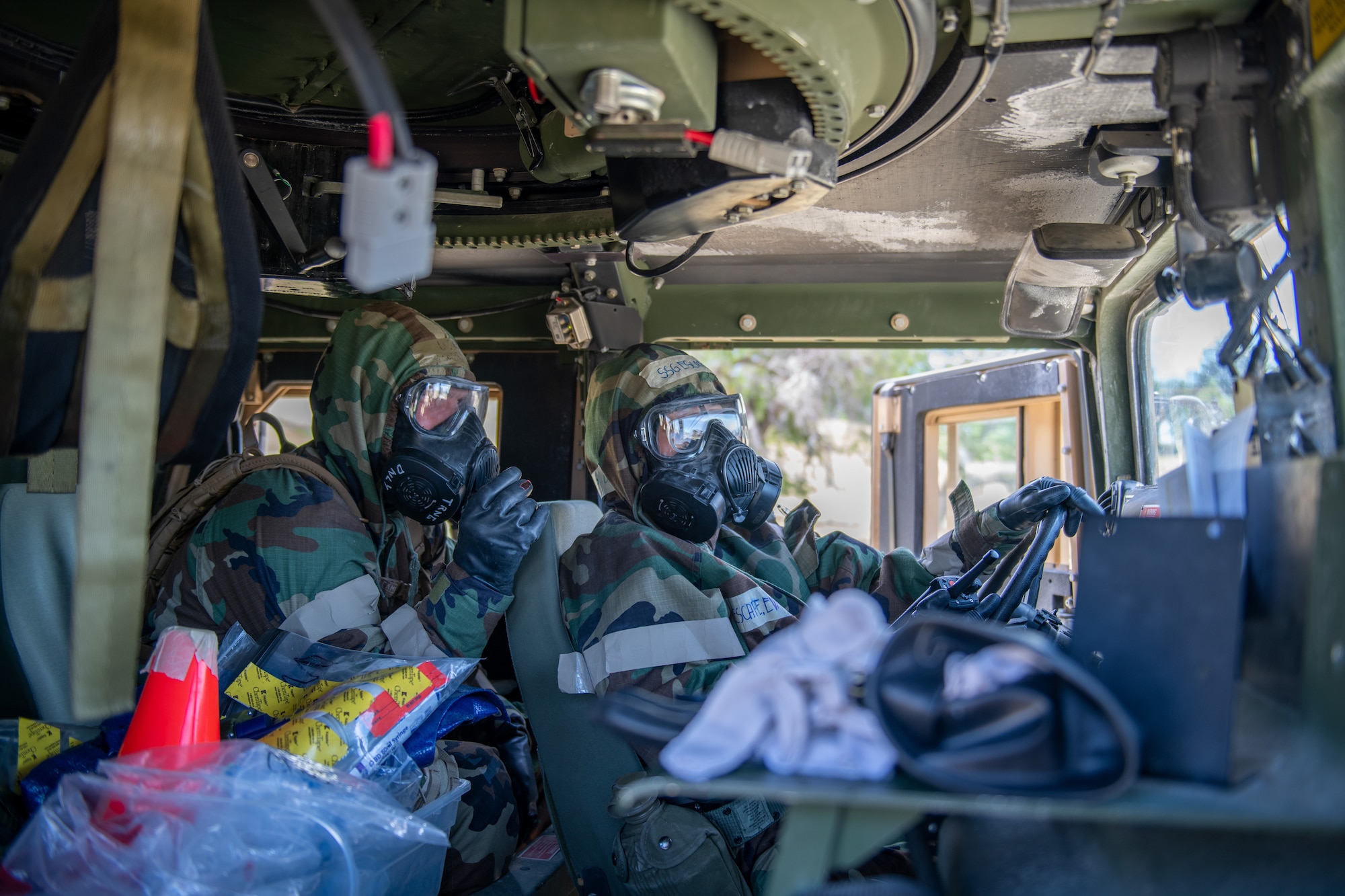 U.S. Air Force Senior Airman Codie Braegger, 419th Civil Engineer Squadron, and Staff Sgt. Eva Escape, 446th Civil Engineer Squadron, await instructions during a simulated gas contamination event at the Patriot Warrior exercise at Hill Air Force Base, Utah, June 11 2022.