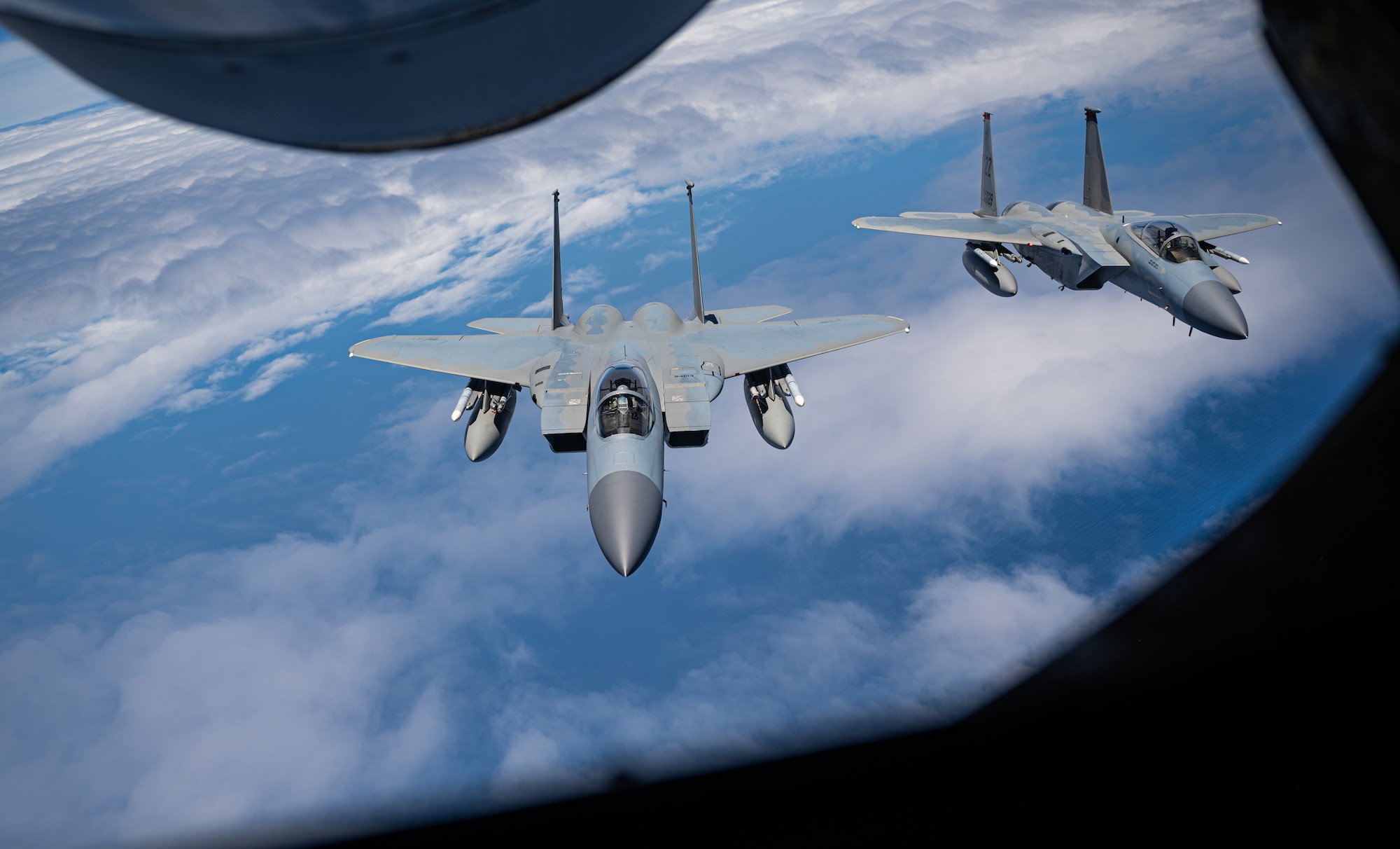 Planes fly over the ocean.