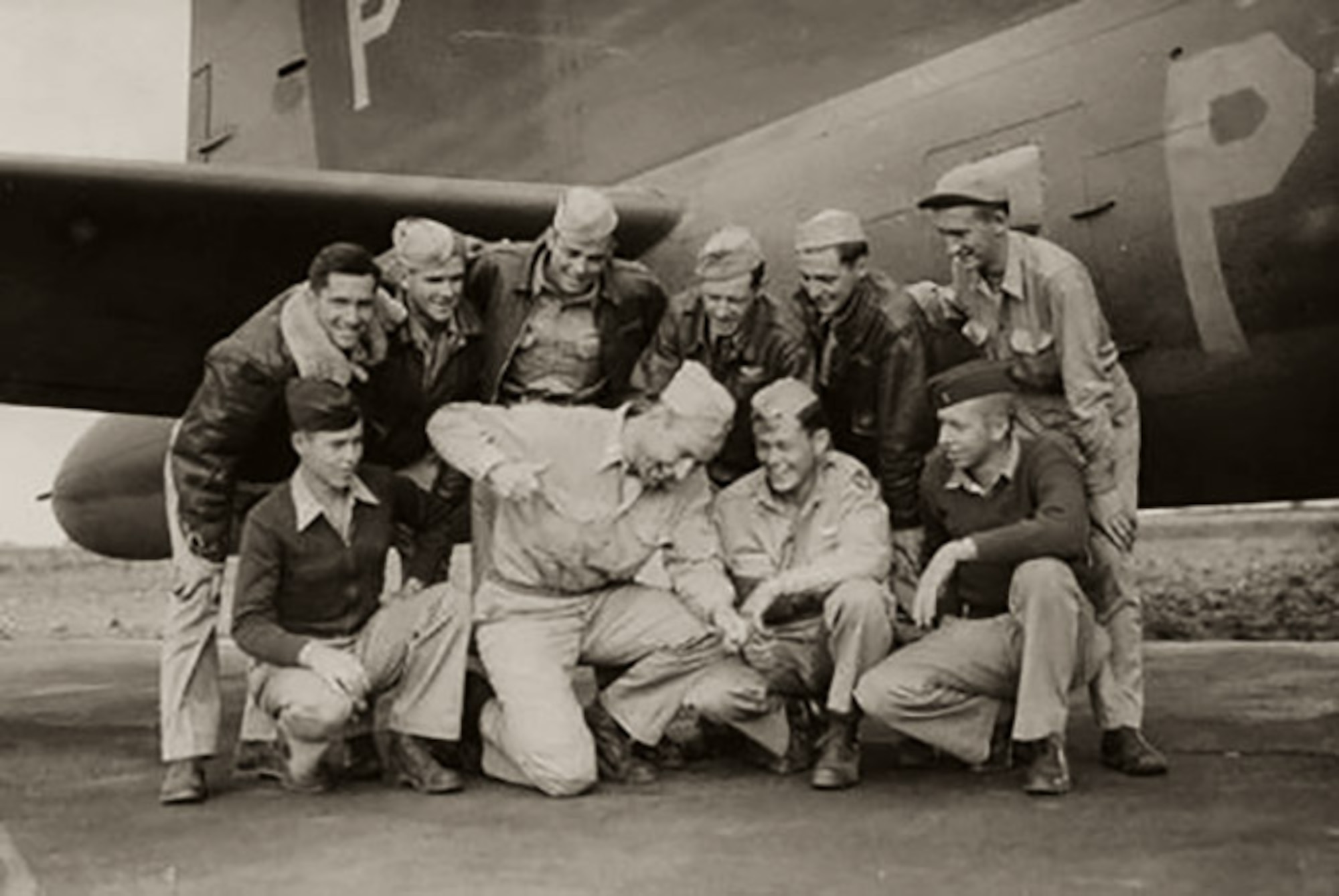 Then-1st Lt. Robert “Bob” Wolff, front row, second from right, 100th Bomb Group and World War II veteran and pilot, along with his crew – known as the “Wolff Pack” – pose for a photo in 1943 at Thorpe Abbotts, England, after returning from the Regensburg mission over Germany. Wolff was a B-17 Flying Fortress pilot and well known for his affability, good sense of humor and remarkable flying skills. (Photo courtesy of 100th Bomb Group Foundation photo archives)