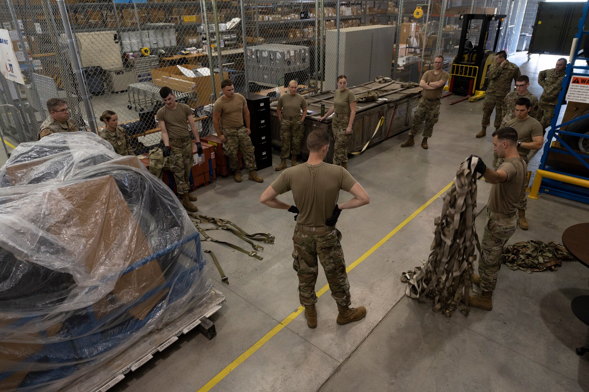 Airmen with 167th Logistics Readiness Squadron review proper netting procedures before beginning a pallet training event at the 167th Airlift Wing, Martinsburg, West Virginia, June 9, 2022. Building pallets like these are essential to quickly and safely load and unload U.S. Air Force cargo aircraft.