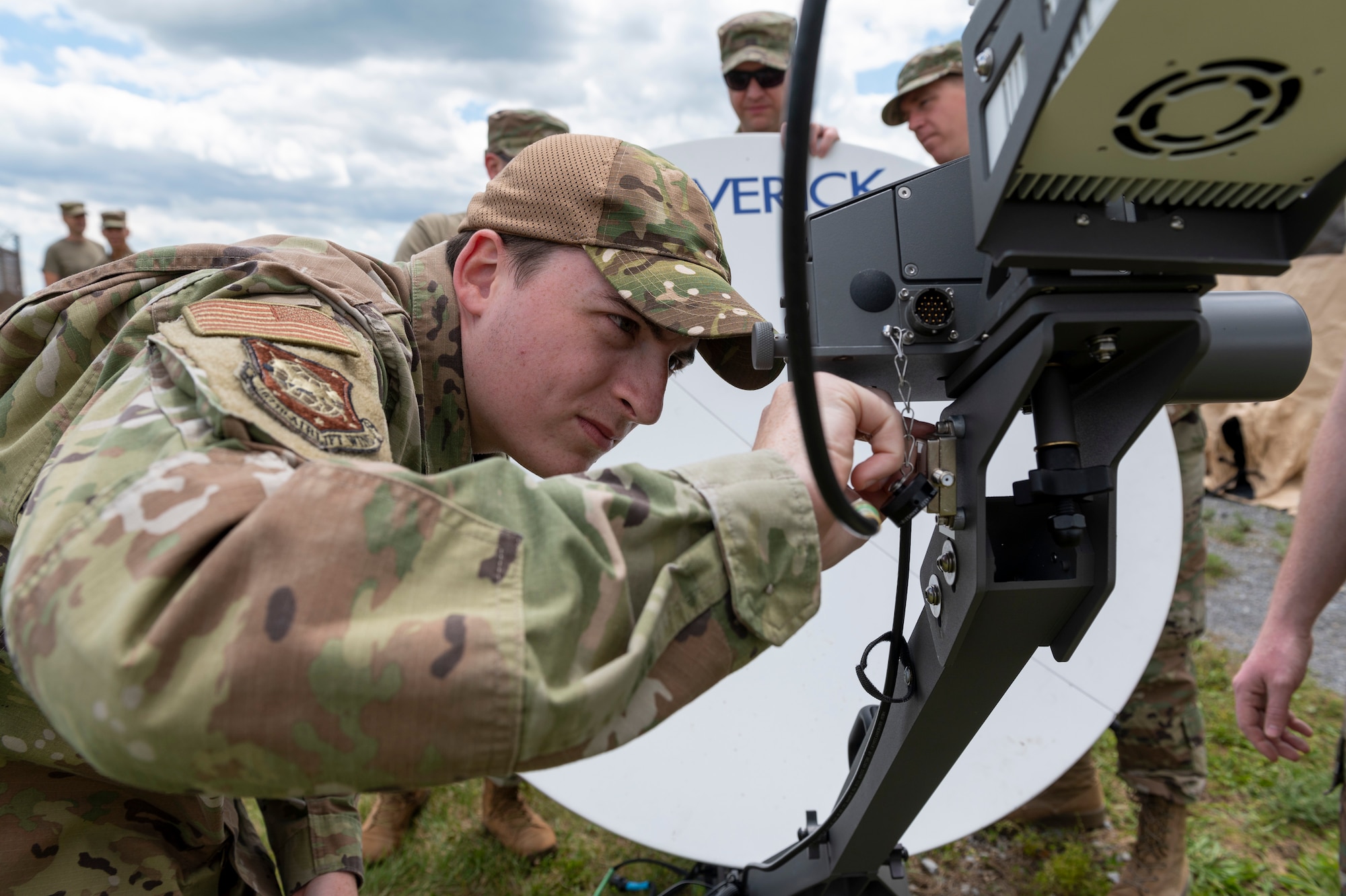 U.S. Air Force Airman 1st Class Joseph Gallman, a cyber security specialist with the 167th Communications Squadron, disassembles a satellite component during a joint incident site communications capability (JISCC) training event at the 167th Airlift Wing, Martinsburg, West Virginia, June 9, 2022. The JISCC system allows communication between civilian and military partners in environments where communication assets are not available.