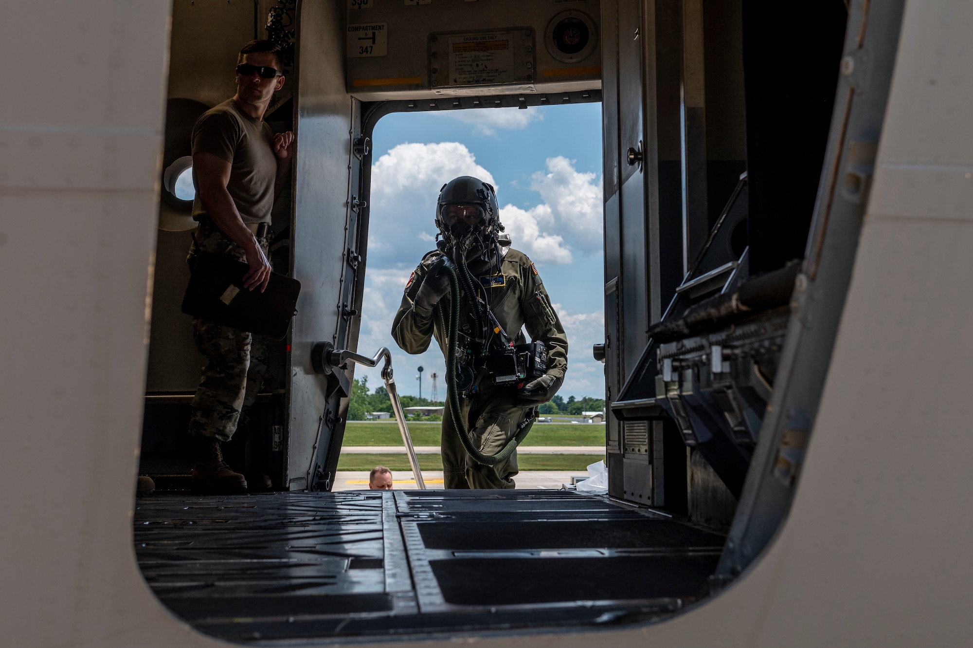 U.S. Air Force Captain Alex Kenney, a pilot with the 167th Airlift Squadron, boards a C-17 Globemaster III aircraft during a simulated chemical environment training at the 167th Airlift Wing, Martinsburg, West Virginia, June 10, 2022. This training included maintainers, loadmasters, pilots and other personnel to simulate the process of preparing, loading and flying the aircraft while in a hazardous chemical environment