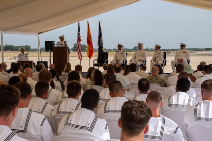 Sailors sit and attend the establishment ceremony for Helicopter Maritime Strike Squadron (HSM) 79 detachment, Rota, Spain