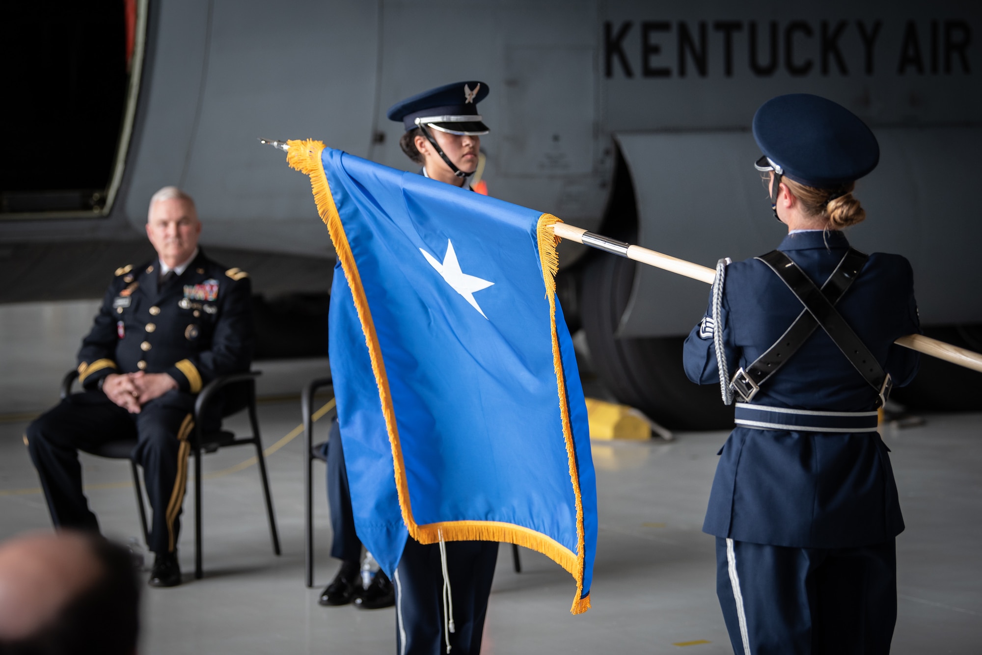 Members of the 123rd Airlift Wing Color Guard unfurl the personal flag of Brig. Gen. Mary S. Decker, chief of staff for Joint Force Headquarters — Air, Kentucky National Guard, during her promotion ceremony June 11, 2022, at the Kentucky Air National Guard Base in Louisville, Ky. Decker joined the Air Force in 1987 as an airman basic. (U.S. Air National Guard photo by Dale Greer)
