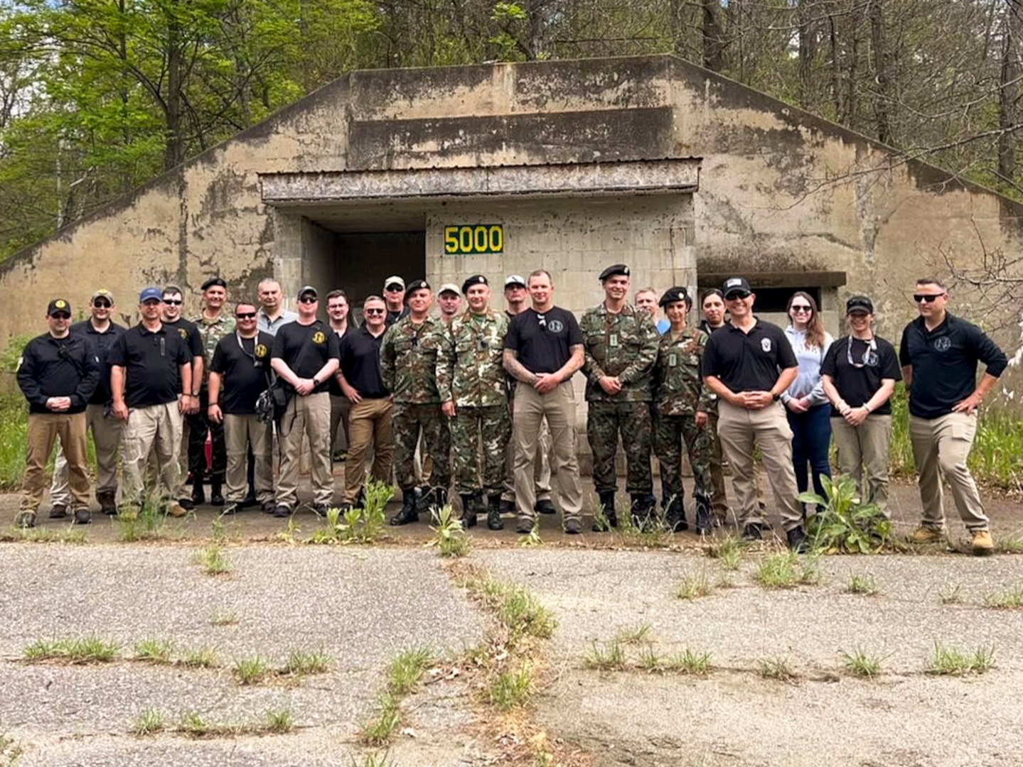 A group photo of the 15th Civil Support Team, Vermont National Guard, and a chemical, biological, radiological and nuclear battalion from the North Macedonia Army during a State Partnership Program engagement in Colchester, Vt., June 6-11, 2022. The engagement focused on working with civil authorities in the event of a disaster.
