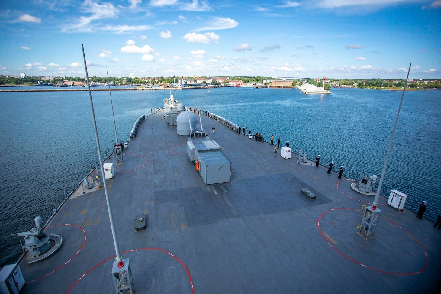 Sailors and Marines man the rails aboard the Blue Ridge-class command and control ship USS Mount Whitney (LCC 20) in the Baltic Sea as the ship prepares to make port in Kiel, Germany, June 16, 2022 during exercise BALTOPS22.