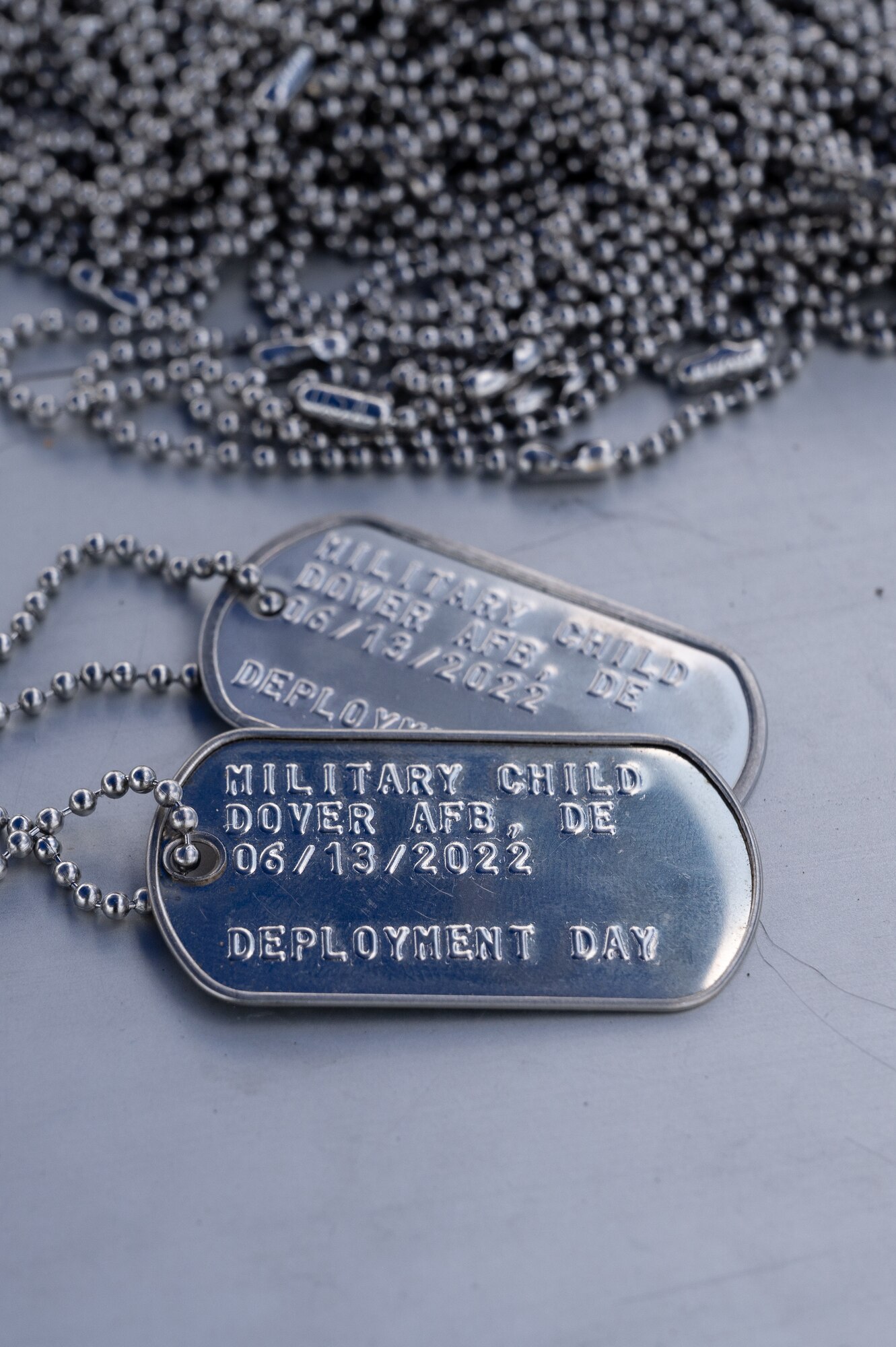 Dog tags were handed out as gifts during the 2022 Children’s Day Celebration at Dover Air Force Base, Delaware, June 13, 2022. This year’s celebration offered outdoor activities and a mock deployment line to Team Dover families. (U.S. Air Force photo by Mauricio Campino)