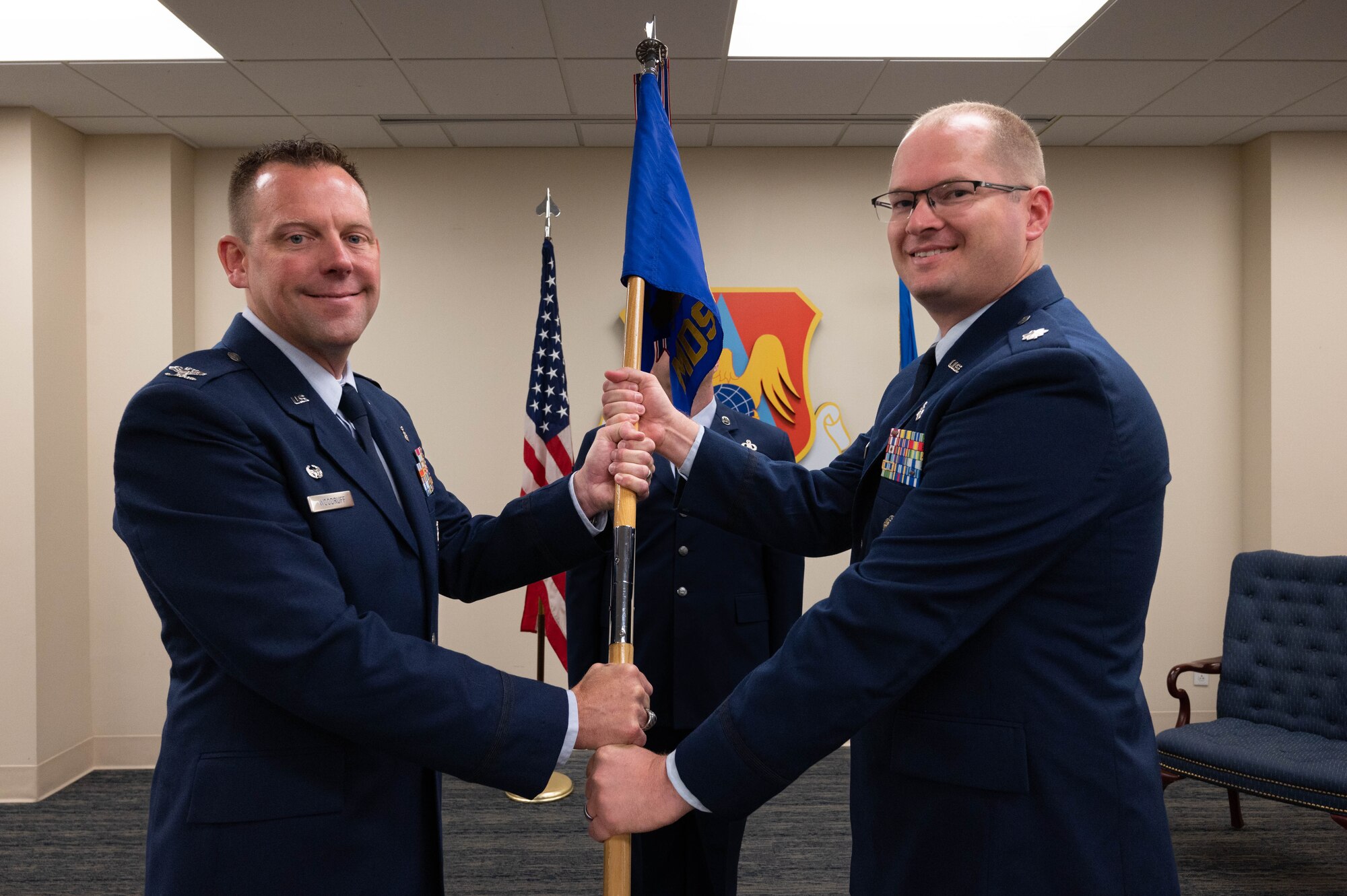 Airmen hold guidon