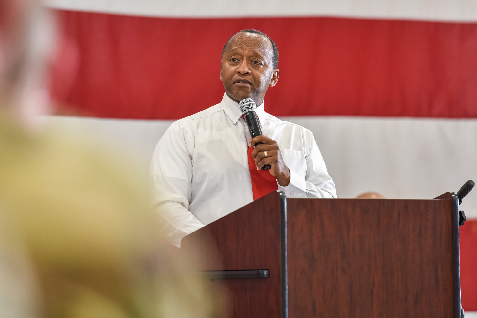 John Pope, retired U.S. Air Force Chief Master Sgt. and Galilee Baptist Church pastor, delivers a speech during the Juneteenth commemoration ceremony at Goodfellow Air Force Base, Texas, June 16, 2022. During the event, Pope spoke about the importance of Juneteenth and his experiences as an African American. (U.S. Air Force photo by Staff Sgt. Jermaine Ayers)