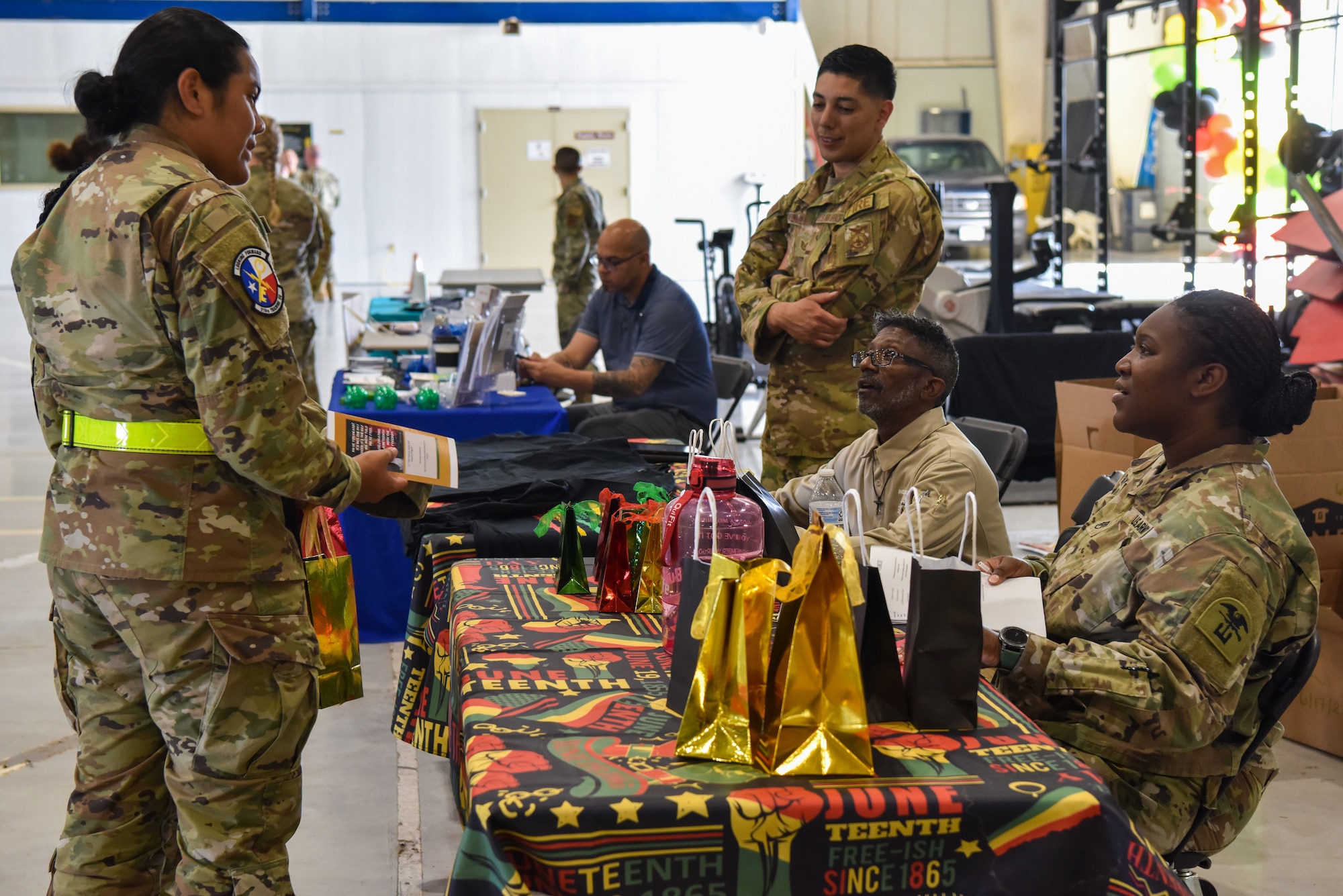 Goodfellow students engage in a Juneteenth trivia game during the Juneteenth commemoration ceremony at Goodfellow Air Force Base, Texas, June 16, 2022. Members were awarded prizes for correct answers. (U.S. Air Force photo by Staff Sgt. Jermaine Ayers)