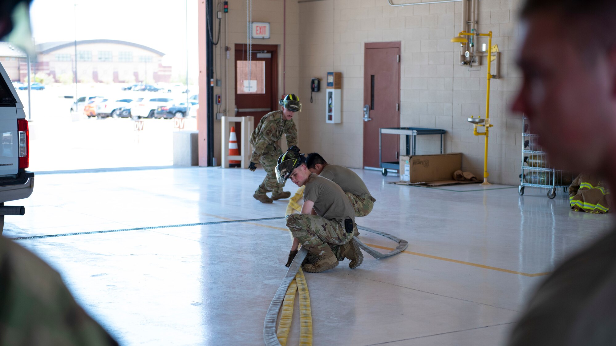 Airmen from the 49th Civil Engineer Squadron lay 50 feet of attack line, June 17, 2022, on Holloman Air Force Base, New Mexico.