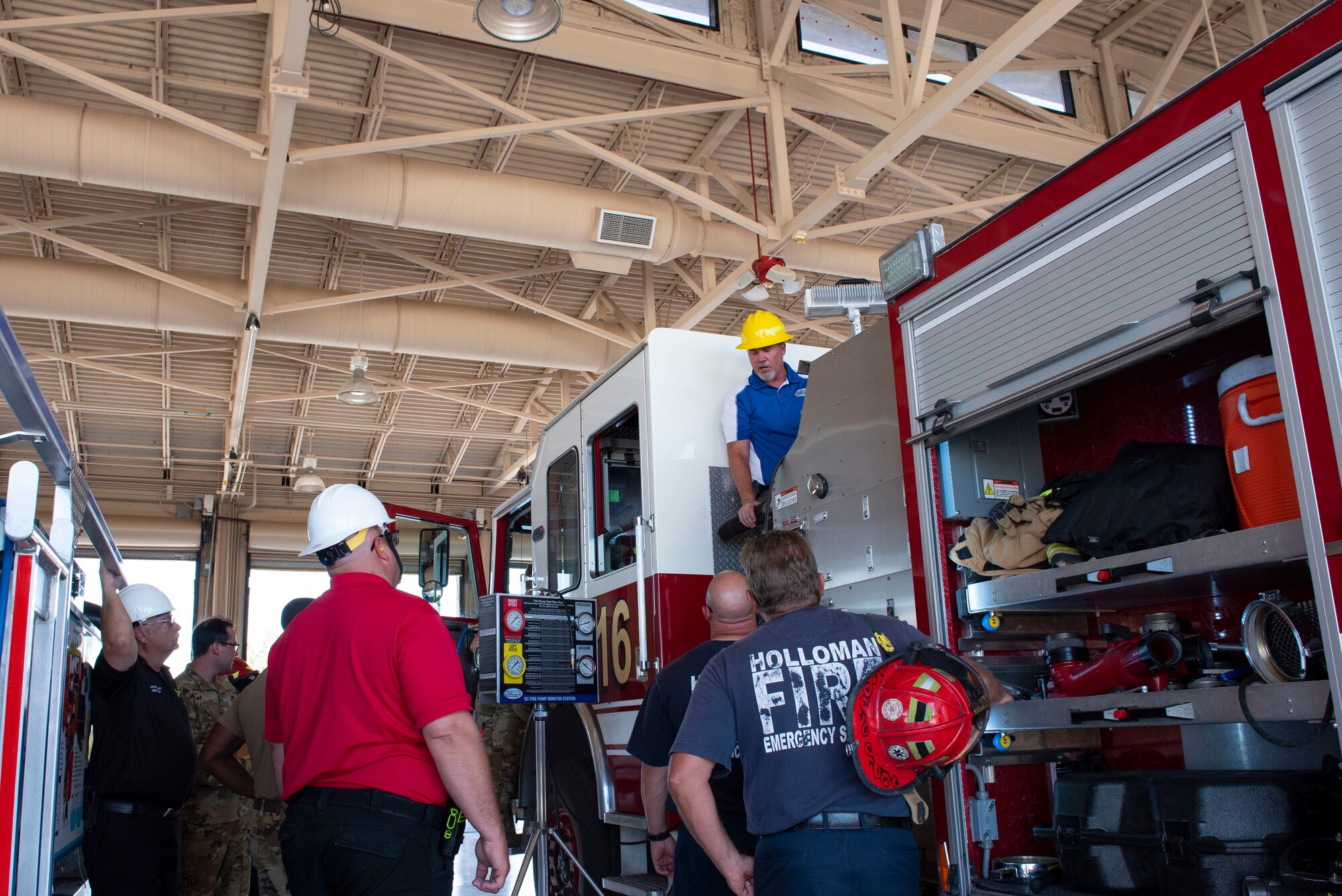 Steven Robertson, Draft Commander training and specialty technician, prepares to open and close the valves on a firetruck, June 15, 2022, on Holloman Air Force Base, New Mexico.