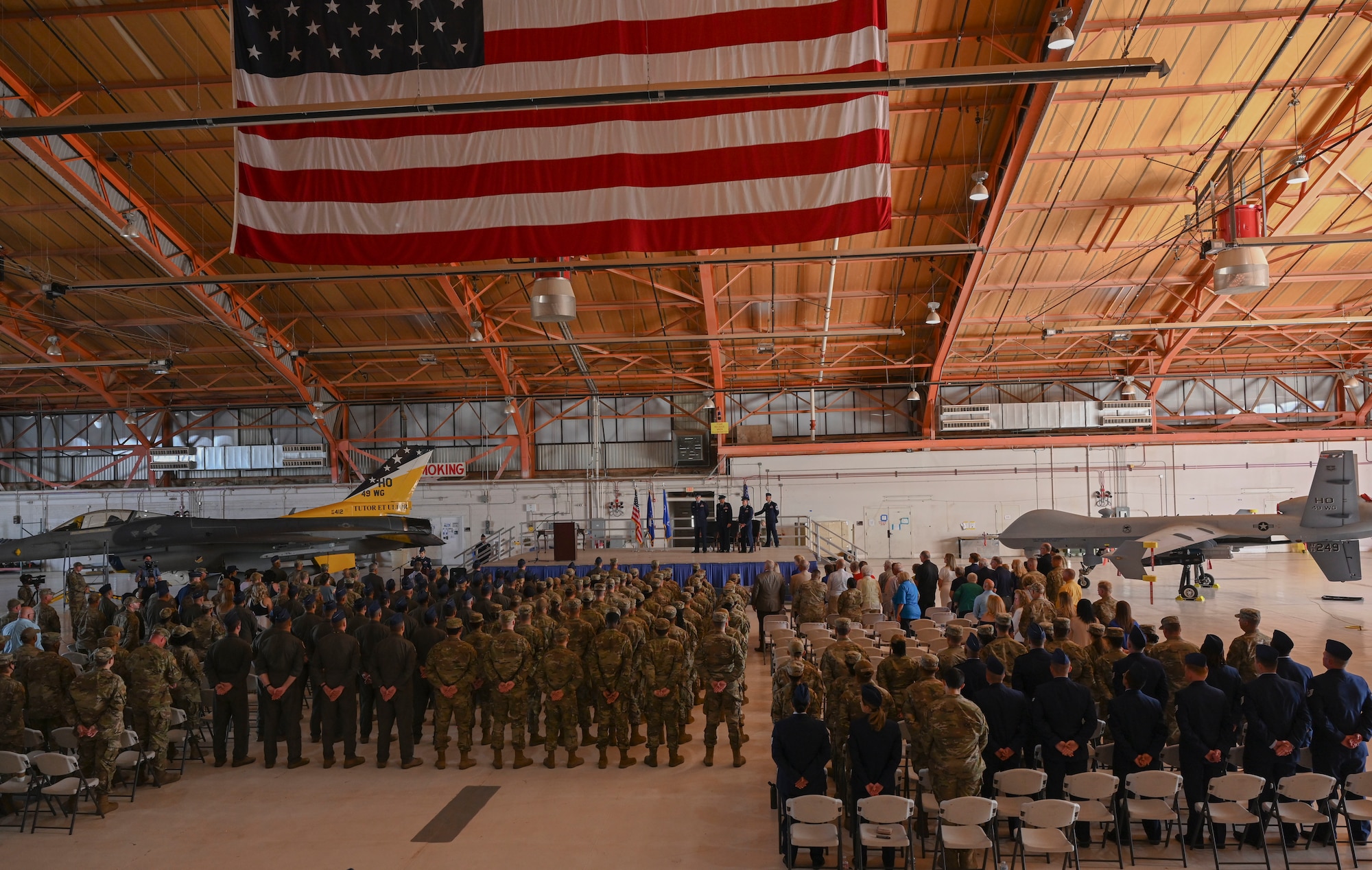 Members of Team Holloman and local community members  gather for the 49th Wing change of command ceremony, June 17, 2022, on Holloman Air Force Base, New Mexico. Command of the 49th Wing was transferred from Col. Ryan P. Keeney to Col. Justin B. Spears. (U.S. Air Force photo by Airman 1st Class Antonio Salfran)