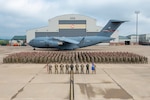 The Airmen of the 167th Airlift Wing stand in formation in front of one of the wing’s eight C-17 Globemaster III aircraft, Shepherd Field, Martinsburg W.Va., June 13, 2022. The wing photo concluded an extended unit training assembly held June 9-12, which focused on job-specific skills training the first two days followed by readiness training classes