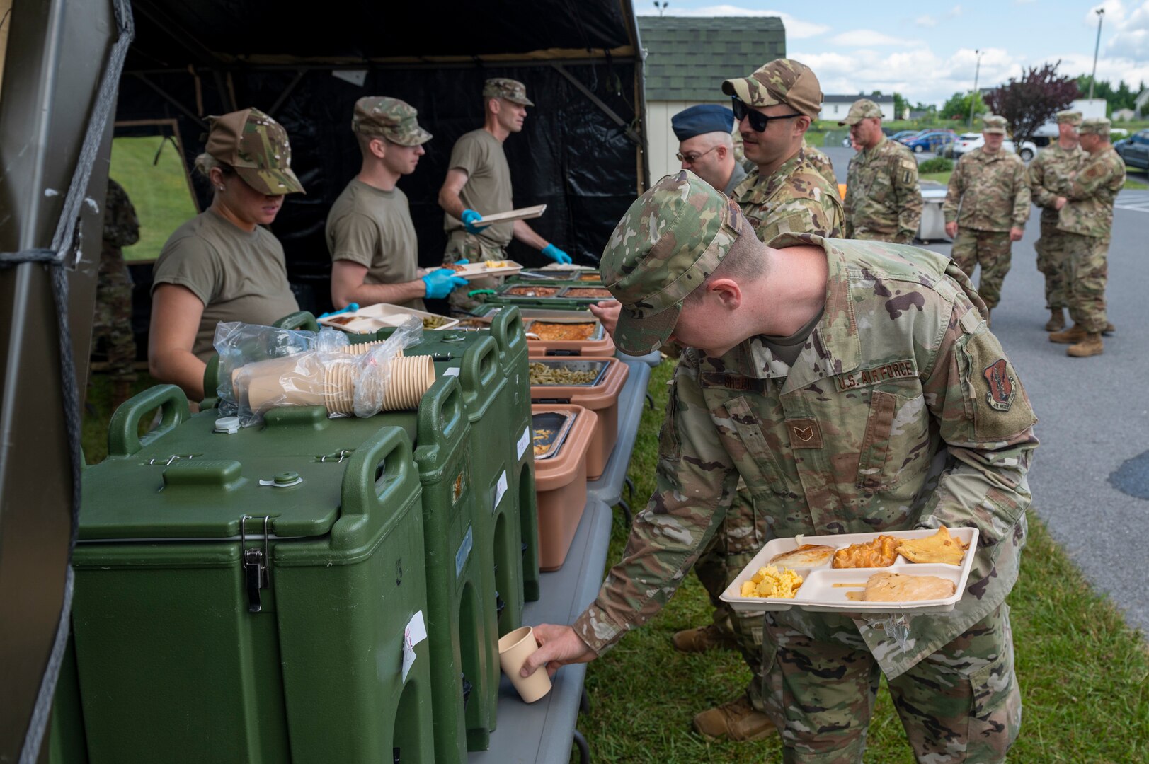 U.S. Air Force Staff Sgt. Joshua Shuck, fuel system specialist with the 167th Maintenance Group, gets his lunch at a single pallet expeditionary kitchen (SPEK) during June’s regularly scheduled drill training event at the 167th Airlift Wing, Martinsburg, West Virginia, June 9, 2022. A SPEK designed to be used in a deployed environment but was set up and used for training purposes during a unit training assembly.