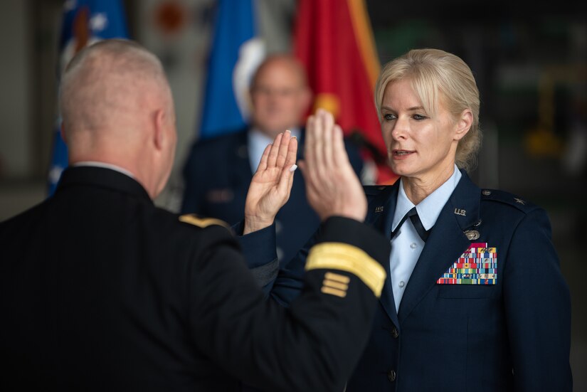 The adjutant general of the Kentucky National Guard, Army Maj. Gen. Haldane B. Lamberton, left, administers the Oath of Office to Mary S. Decker, chief of staff for Joint Force Headquarters — Air, Kentucky National Guard, during a ceremony promoting her to the rank of brigadier general at the Kentucky Air National Guard Base in Louisville, Ky., June 11, 2022. Decker joined the Air Force in 1987 as an airman basic. (U.S. Air National Guard photo by Dale Greer)