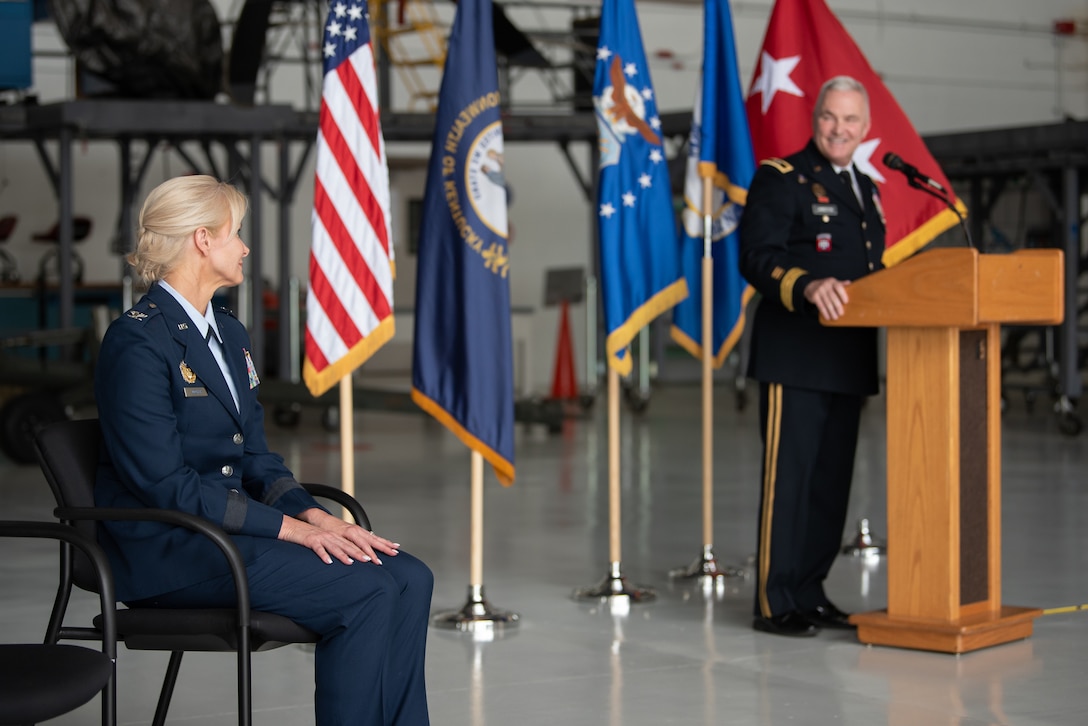 The adjutant general of the Kentucky National Guard, Army Maj. Gen. Haldane B. Lamberton, speaks to the audience during a ceremony to promote Mary S. Decker, left, chief of staff for Joint Force Headquarters — Air, Kentucky National Guard, to the rank of brigadier general at the Kentucky Air National Guard Base in Louisville, Ky., June 11, 2022. Decker joined the Air Force in 1987 as an airman basic. (U.S. Air National Guard photo by Dale Greer)