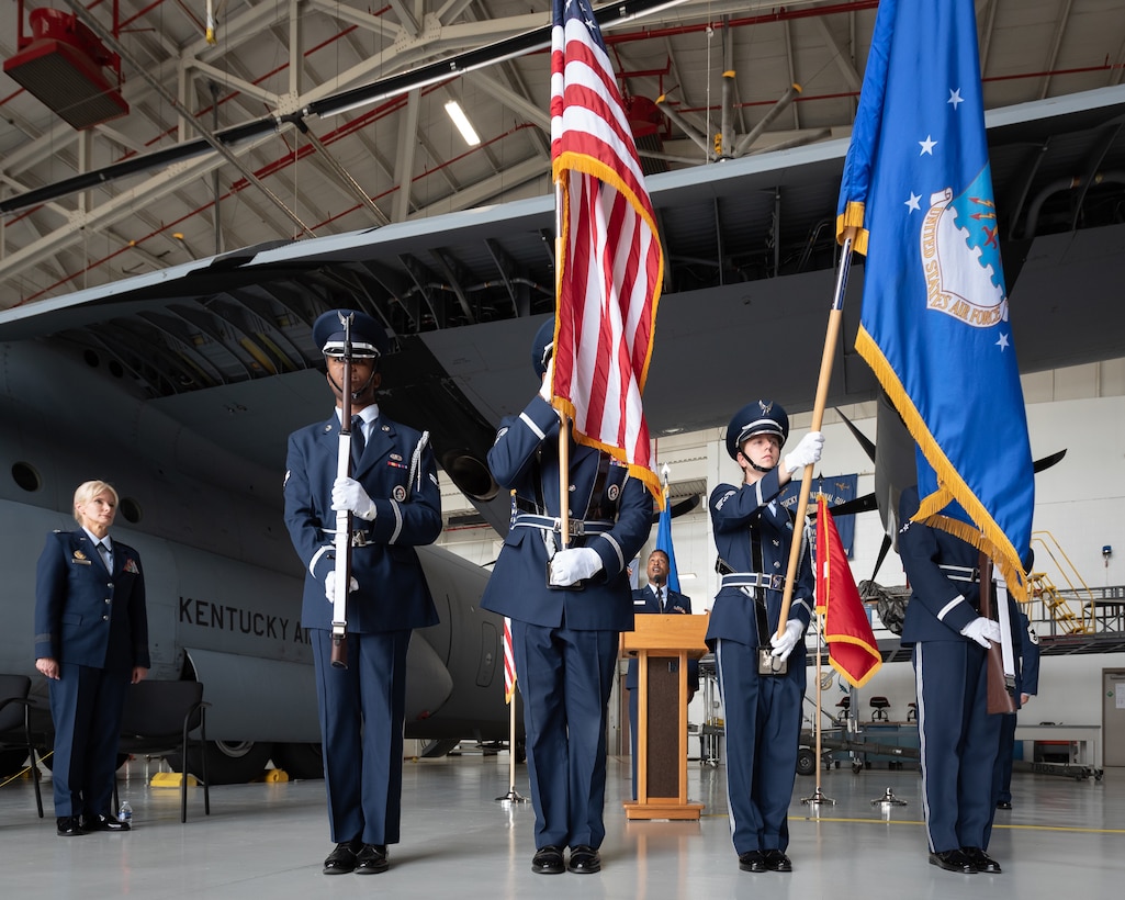 The 123rd Airlift Wing Color Guard presents the colors as Capt. Phillip Garrard sings the National Anthem during a ceremony to promote Mary S. Decker, chief of staff for Joint Force Headquarters — Air, Kentucky National Guard, to the rank of brigadier general at the Kentucky Air National Guard Base in Louisville, Ky., June 11, 2022. Decker joined the Air Force in 1987 as an airman basic. (U.S. Air National Guard photo by Dale Greer)