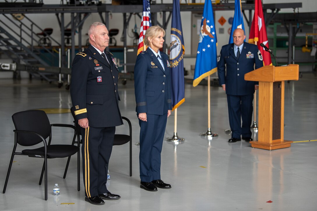 Mary S. Decker, center, chief of staff for Joint Force Headquarters — Air, Kentucky National Guard, is promoted to the rank of brigadier general during a ceremony at the Kentucky Air National Guard Base in Louisville, Ky., June 11, 2022. Decker joined the Air Force in 1987 as an airman basic. (U.S. Air National Guard photo by Dale Greer)