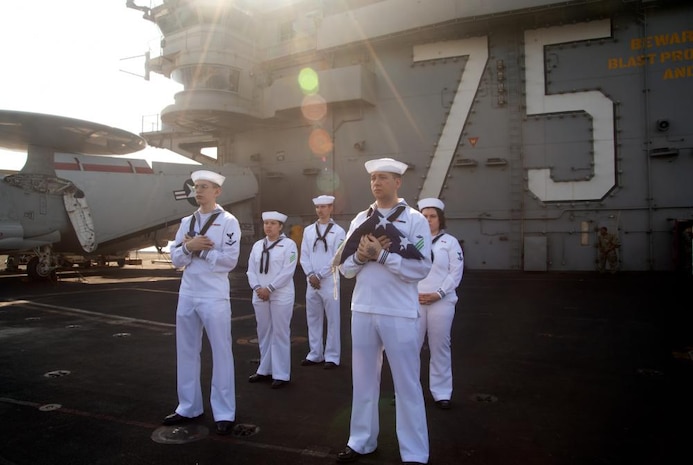 (June 18, 2022) Sailors standby for color detail on the flight deck of USS Harry S. Truman (CVN 75) as the ship pulls into Marseille, France for a scheduled port visit, June 18, 2022. The Harry S. Truman Carrier Strike Group is on a scheduled deployment in the U.S. Naval Forces Europe area of operations, employed by U.S. Sixth Fleet to defend U.S., allied and partner interests.