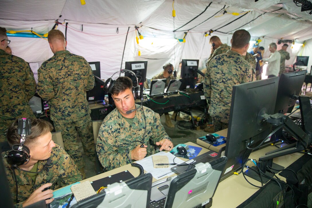 U.S. Marines with Marine Air Control Squadron 4, Marine Air Control Group (MACG) 18, support command and control of aircraft at Andersen Air Force Base, Guam, June 13, 2022, in support of Valiant Shield 2022. Exercise Valiant Shield gives units like MACG-18 the opportunity to integrate with forces across the Indo-Pacific to train in successful employment and operations that demonstrate the strength and versatility of the Joint Force. (U.S. Marine Corps photo by Cpl. Tyler Harmon)