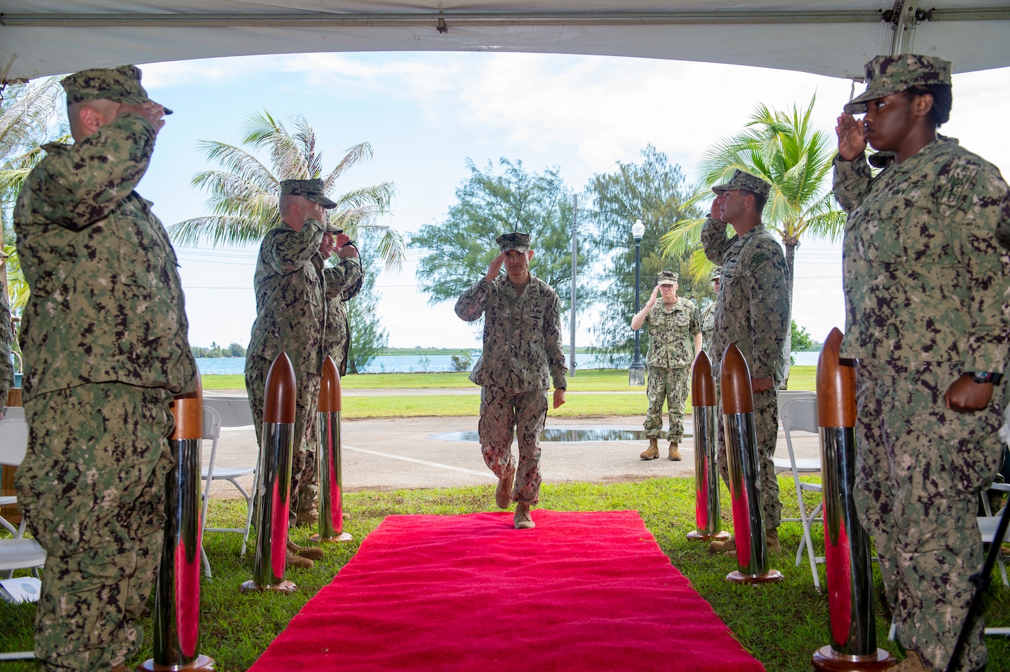PITI, Guam (June 17, 2022) Capt. Shaun Lieb receives honors from side boys during the Commander, Task Force 75 change of command ceremony. Capt. Gareth Healy relinquished command as Commodore, CTF 75 to Lieb. CTF 75 provides expeditionary combat capabilities in the U.S. Navy's 7th Fleet area of operations and is capable of providing the fleet with diverse expeditionary warfighting capabilities that are combat-ready and able to deploy anywhere in U.S. 7th Fleet in response to any contingency. The Navy's expeditionary forces exist first and foremost to support the fleet's warfighting operations and are the Navy's sea-to-shore interface. (U.S. Navy photo by Mass Communication Specialist 1st Class Billy Ho)