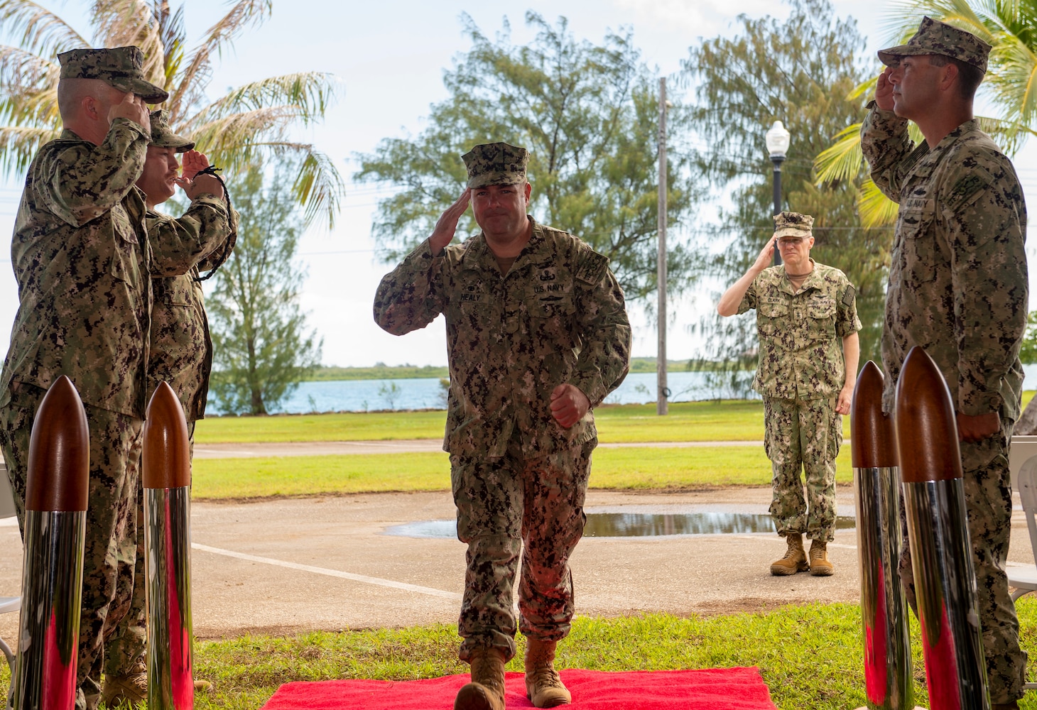 PITI, Guam (June 17, 2022) Capt. Gareth Healy receives honors from side boys during the Commander, Task Force 75 change of command ceremony. Healy relinquished command as Commodore, CTF 75 to Capt. Shaun Lieb. CTF 75 provides expeditionary combat capabilities in the U.S. Navy's 7th Fleet area of operations and is capable of providing the fleet with diverse expeditionary warfighting capabilities that are combat-ready and able to deploy anywhere in U.S. 7th Fleet in response to any contingency. The Navy's expeditionary forces exist first and foremost to support the fleet's warfighting operations and are the Navy's sea-to-shore interface. (U.S. Navy photo by Mass Communication Specialist 1st Class Billy Ho)