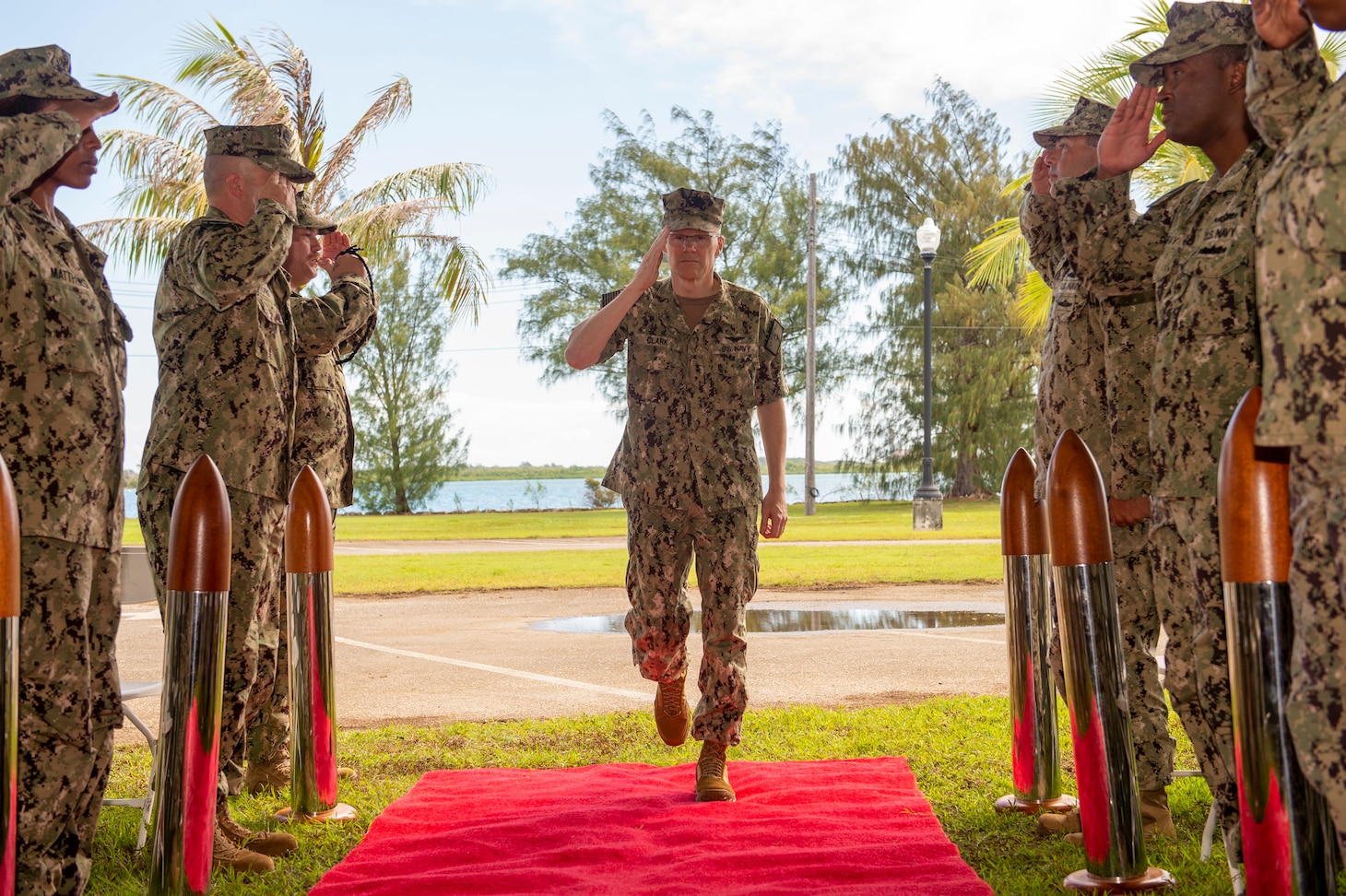 PITI, Guam (June 17, 2022) Vice Commander, U.S. 7th Fleet, Rear Adm. Robert Clark receives honors from side boys during the Commander, Task Force 75 change of command ceremony. Capt. Gareth Healy relinquished command as Commodore, CTF 75 to Capt. Shaun Lieb. CTF 75 provides expeditionary combat capabilities in the U.S. Navy's 7th Fleet area of operations and is capable of providing the fleet with diverse expeditionary warfighting capabilities that are combat-ready and able to deploy anywhere in U.S. 7th Fleet in response to any contingency. The Navy's expeditionary forces exist first and foremost to support the fleet's warfighting operations and are the Navy's sea-to-shore interface. (U.S. Navy photo by Mass Communication Specialist 1st Class Billy Ho)