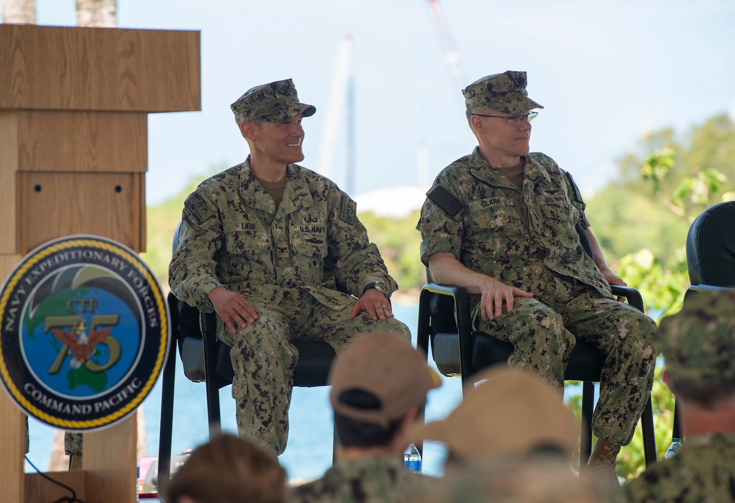 PITI, Guam (June 17, 2022) Vice Commander, U.S. 7th Fleet, Rear Adm. Robert Clark, right and Commodore, Commander, Task Force 75 Capt. Shaun Lieb look on during the change of command ceremony. Capt. Gareth Healy relinquished command as Commodore, CTF 75 to Lieb. CTF 75 provides expeditionary combat capabilities in the U.S. Navy's 7th Fleet area of operations and is capable of providing the fleet with diverse expeditionary warfighting capabilities that are combat-ready and able to deploy anywhere in U.S. 7th Fleet in response to any contingency. The Navy's expeditionary forces exist first and foremost to support the fleet's warfighting operations and are the Navy's sea-to-shore interface. (U.S. Navy photo by Mass Communication Specialist 1st Class Billy Ho)