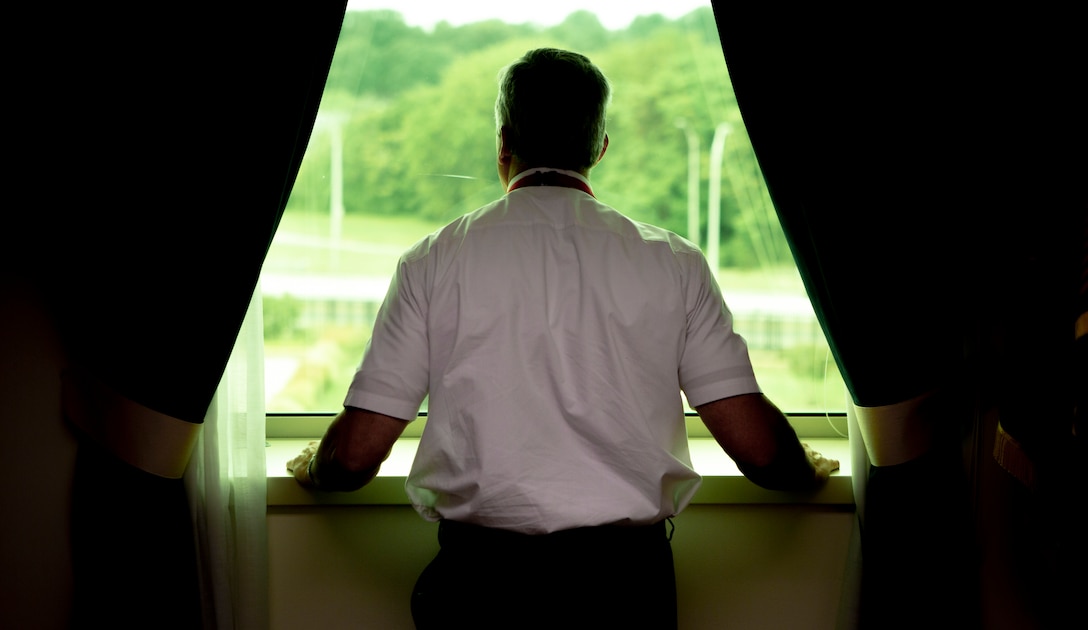 Mr. Robert D. Hogue, counsel for the Commandant of the Marine Corps, looks out of the window in his office at the Pentagon, Arlington, Va., Aug. 13, 2021