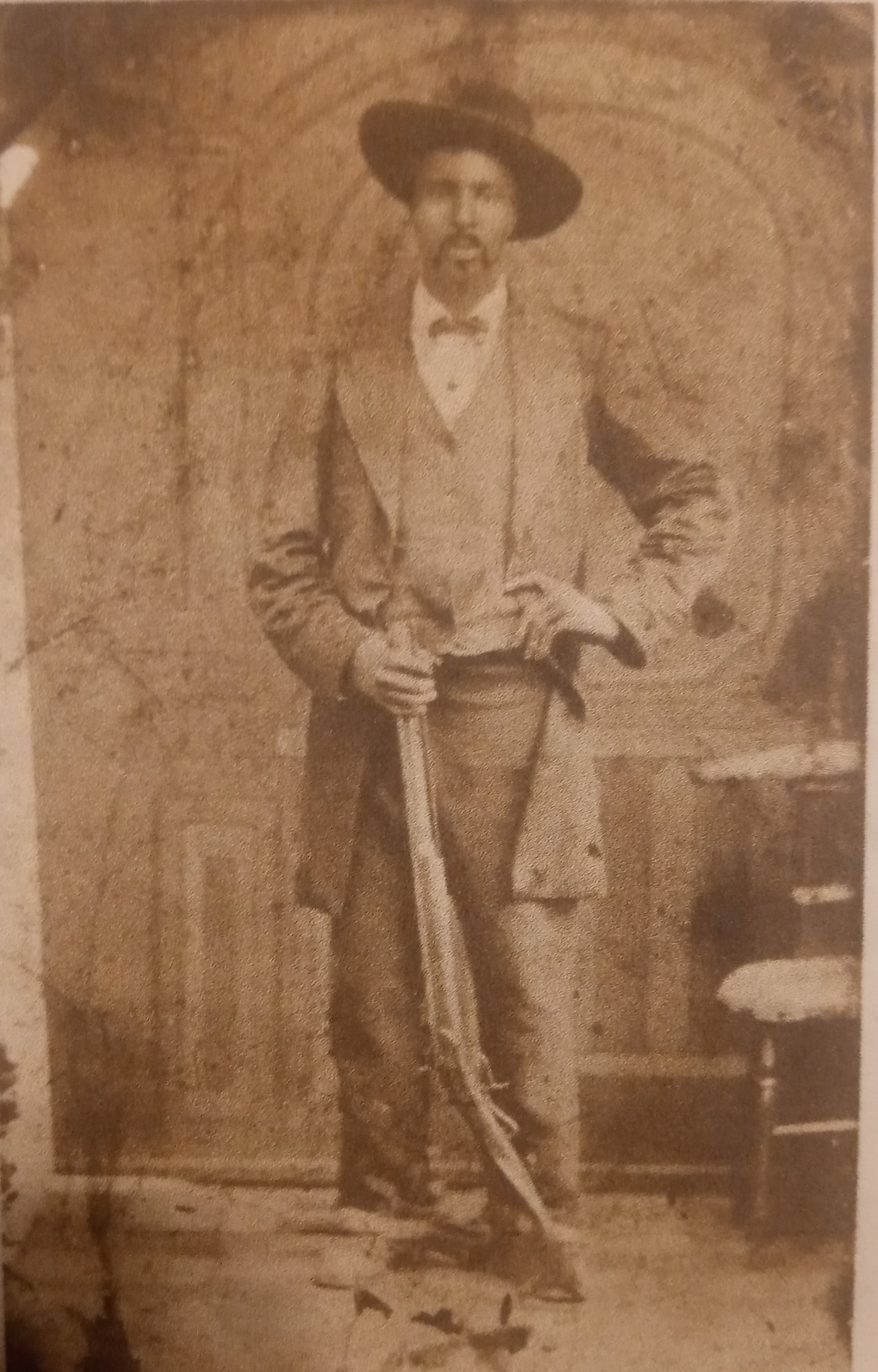 a man poses in the 1800s