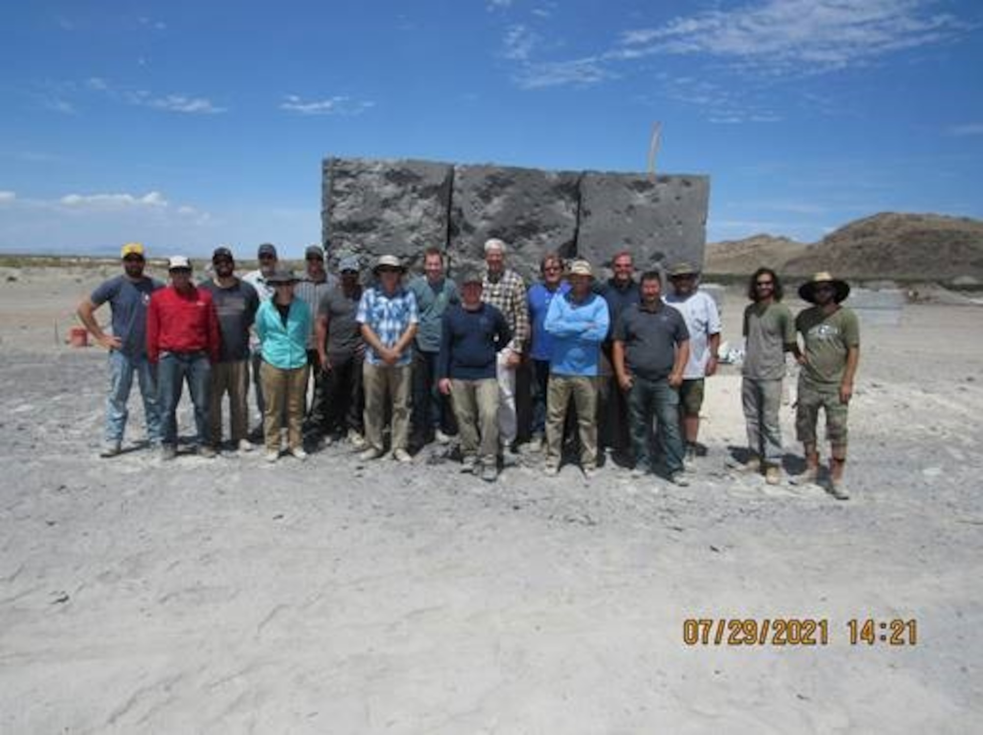 Representatives from Sandia, Explosive Ordinance Test Lab, & BLU-134 Program Office standing in front of Digital Image Correlation (DIC) Box. USAF courtesy photo.