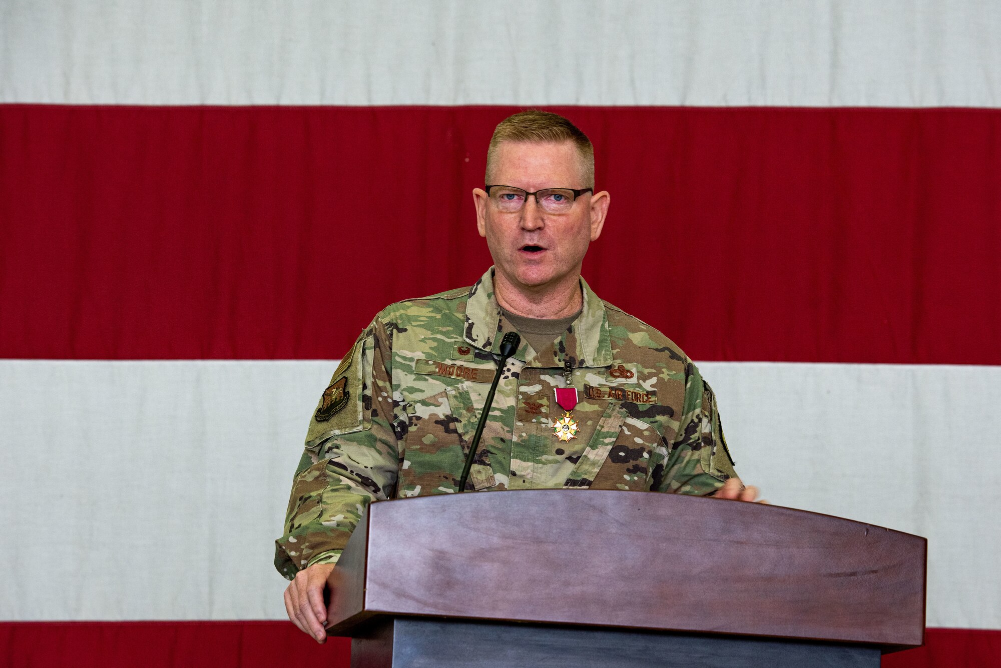 Col. Brian Moore, 51st Maintenance Group outgoing commander, delivers a farewell speech at Osan Air Base, Republic of Korea, June 15, 2022.