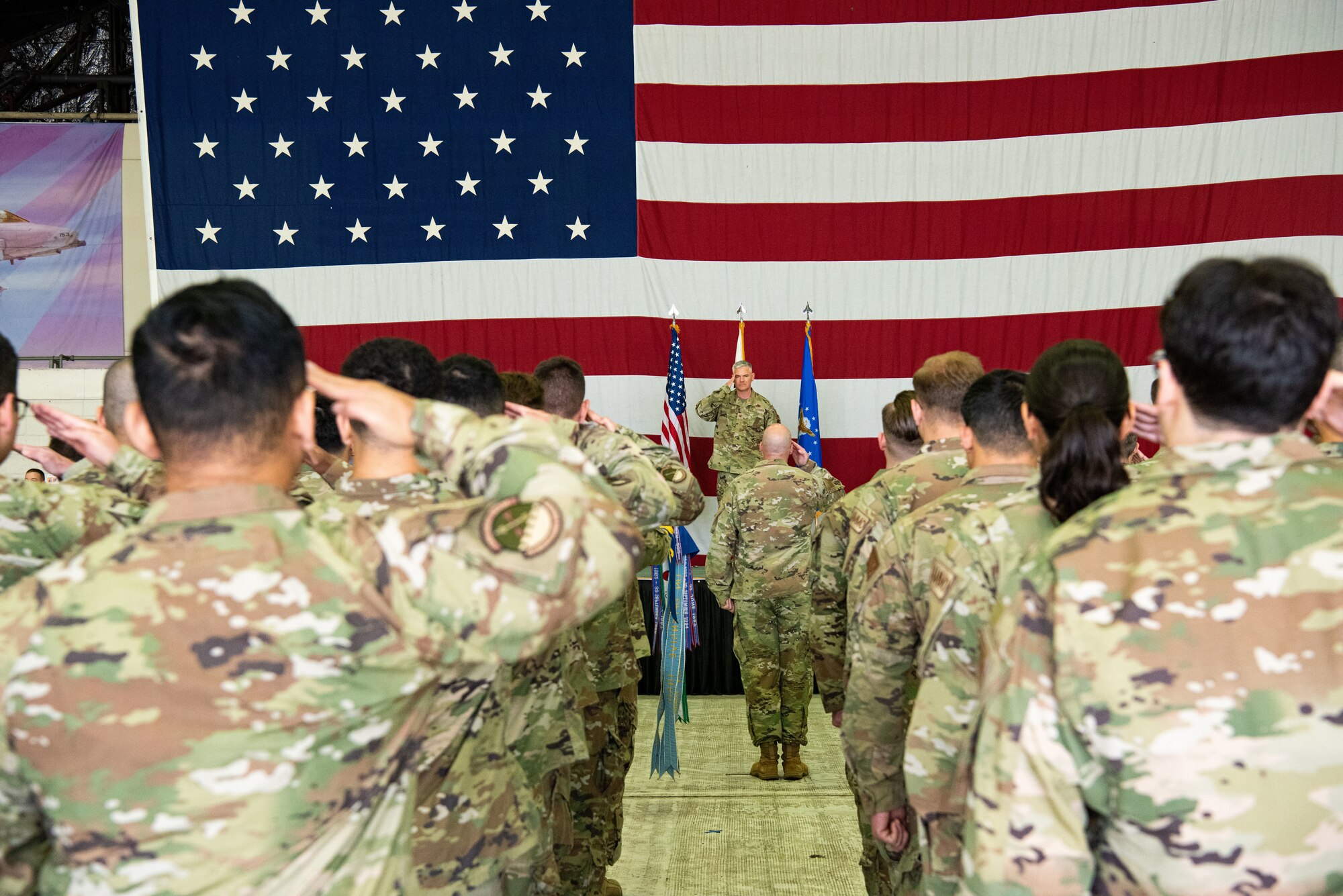 Col. Todd Wydra, 51st Maintenance Group incoming commander, renders his first salute as the 51st MXG commander to his group at Osan Air Base, Republic of Korea, June 17, 2022.