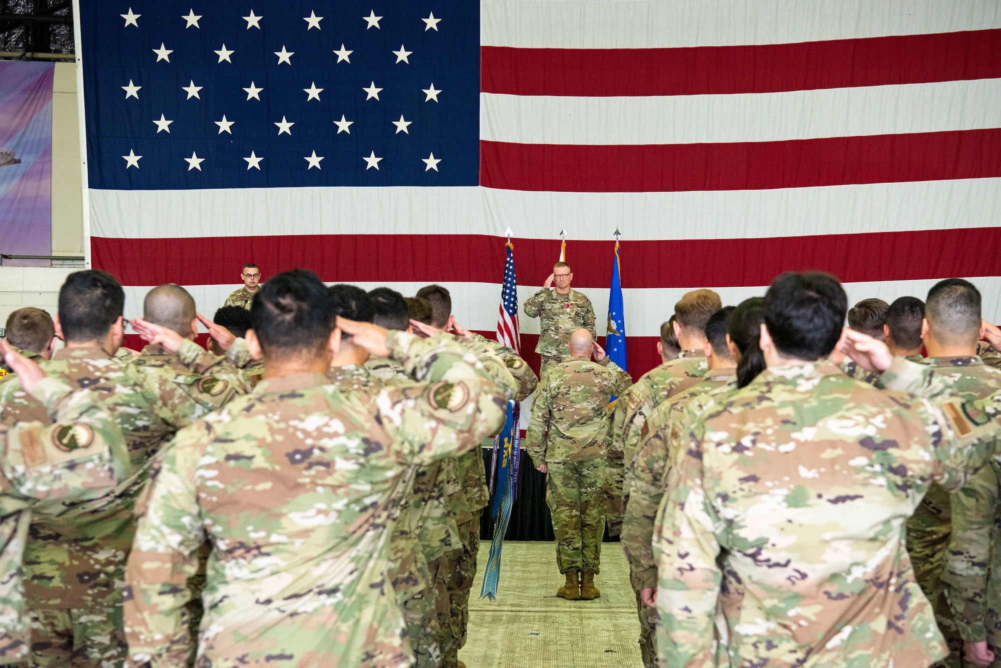 Col. Brian Moore, 51st Maintenance Group outgoing commander, renders a final salute to his squadron at Osan Air Base, Republic of Korea, June 17, 2022.