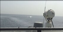 220620-N-NO146-1002 STRAIT OF HORMUZ (June 20, 2022) A video screenshot of Iran’s Islamic Revolutionary Guard Corps Navy (IRGCN) operating in an unsafe and unprofessional manner in close proximity to patrol coastal ship USS Sirocco (PC 6) and expeditionary fast transport USNS Choctaw County (T-EPF 2) in the Strait of Hormuz, June 20.