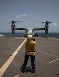 Boatswain’s Mate 2nd Class Amanda Bishop gives signals to the pilot in an MV-22B Osprey assigned to Marine Medium Tiltrotor Squadron (VMM) 266 on the flight deck of the Harpers Ferry-class dock landing ship USS Carter Hall (LSD 50), during exercise Caraibes 2022, June 13, 2022. Caraibes 2022 is a French led, combined and joint training exercise in the Caribbean involving naval, air and land assets. This multi-national exercise aims to promote cooperation among regional forces and their collective ability to successfully provide humanitarian assistance/disaster relief in response to a natural disaster.