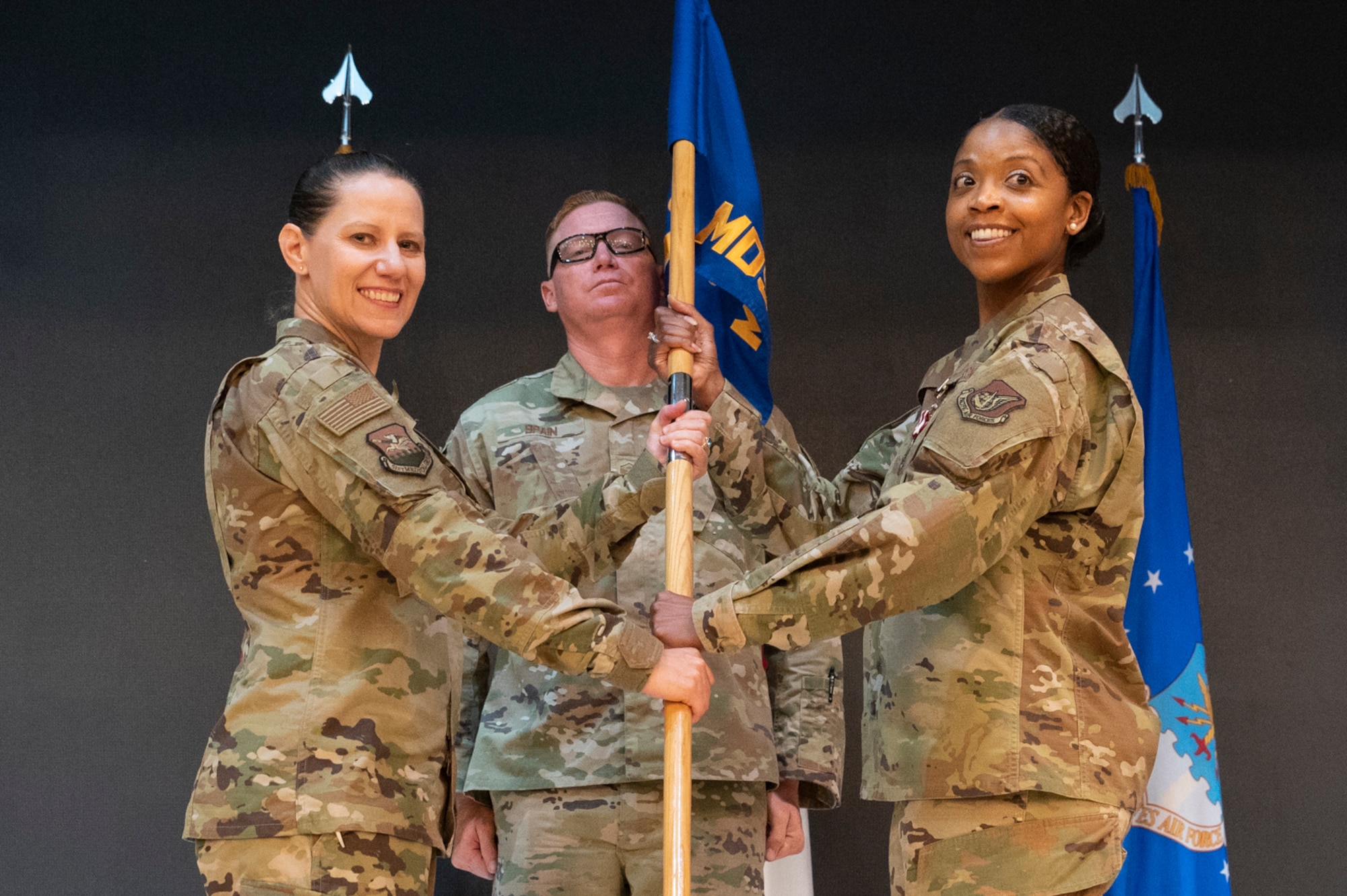 Col. Jennifer Vecchione, 51st Fighter Wing Medical Group commander, left, receives the guidon from Col. Theodosia Montgomery, 51st Medical Support Squadron (MDSS) outgoing commander