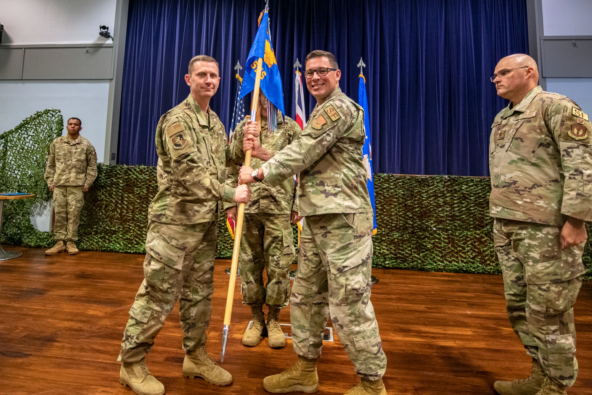 U.S. Air Force Col. Jon T. Hannah, left, 422d Air Base Group commander, receives the 422d Security Forces Squadron guidon from Maj. Thomas W. Uhl, 422d Security Forces Squadron outgoing commander, during a change of command ceremony at RAF Croughton, England, June 16, 2022. Throughout his command, Uhl led over 200 Defenders, Ministry of Defence Police and Guard along with augmentees in providing security for the U.S. Air Force’s only Bomber Forward Operation location and protection level 1 resources within the United Kingdom. (U.S. Air Force photo by Staff Sgt. Eugene Oliver)