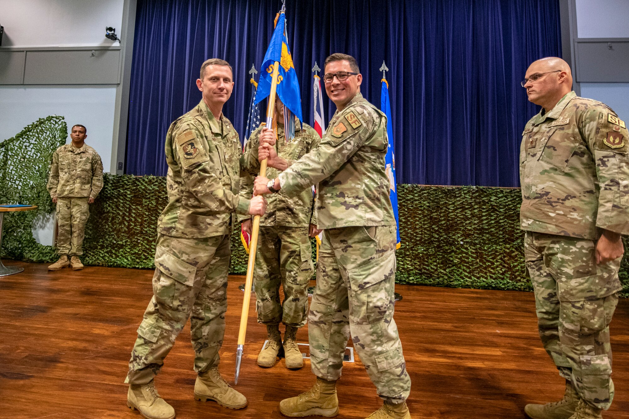 U.S. Air Force Col. Jon T. Hannah, left, 422d Air Base Group commander, receives the 422d Security Forces Squadron guidon from Maj. Thomas W. Uhl, 422d Security Forces Squadron outgoing commander, during a change of command ceremony at RAF Croughton, England, June 16, 2022. Throughout his command, Uhl led over 200 Defenders, Ministry of Defence Police and Guard along with augmentees in providing security for the U.S. Air Force’s only Bomber Forward Operation location and protection level 1 resources within the United Kingdom. (U.S. Air Force photo by Staff Sgt. Eugene Oliver)