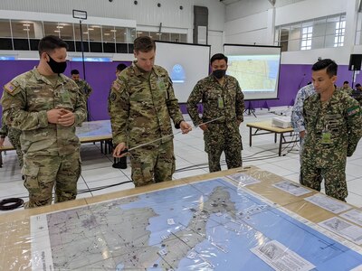 U.S. Army and Malaysian Army personnel plan operations against a fictitious enemy during the eighth annual Bersama Warrior exercise in Kuantan, Malaysia, June 12, 2022. Bersama Warrior is an annual joint and bilateral exercise sponsored by U.S. Indo-Pacific Command and hosted by the Malaysian Armed Forces.