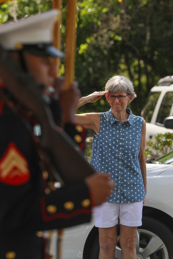 A spectator salutes the colors during the Memorial Day Ceremony and parade in Beaufort, South Carolina, May 30, 2022. Memorial Day is a day to honor all the men and women who have made the ultimate sacrifice in service to their country. (U.S. Marine Corps photo by Cpl. Hernan Rodriguez)