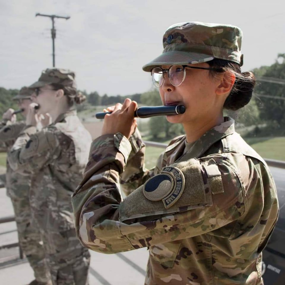Spc. Jessica Tang plays the flute with the 29th Division Band.