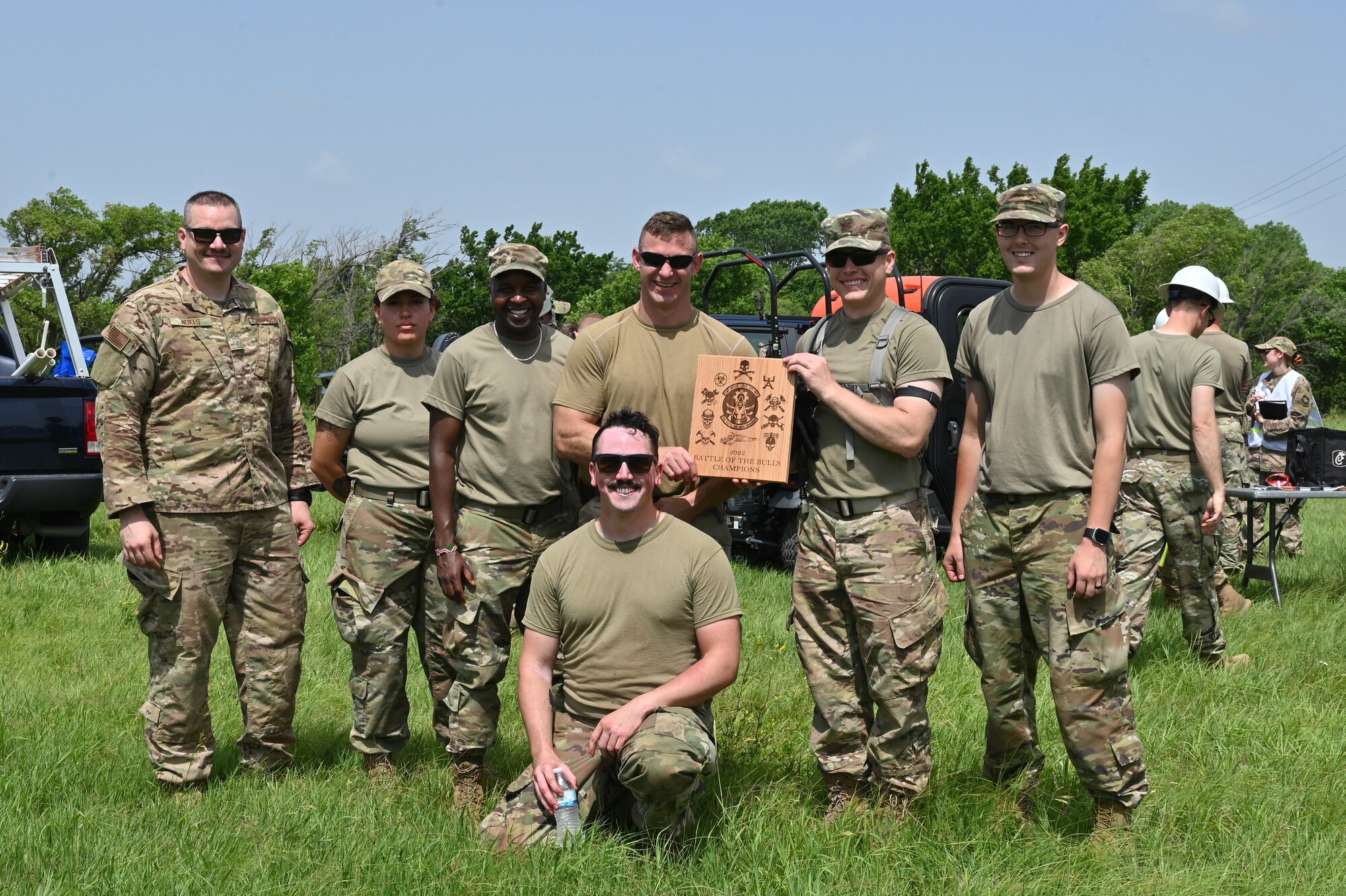 Airmen from the 22nd Civil Engineer Squadron pose with their trophy after winning the “Battle of the Bulls” training exercise June 15, 2022, at McConnell Air Force Base, Kansas.