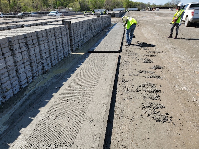 IN THE PHOTO, Some of these squares cast will likely be used on Armor 1 (the new Mat Sinking Unit), so it is imperative that all squares meet the contract specifications. With the Mat Sinking Unit stocked with ACM and ready to go, the district can continue to provide riverbank protection along with sound, navigable waters for the industries transporting goods up and down the river. (Courtesy photo)